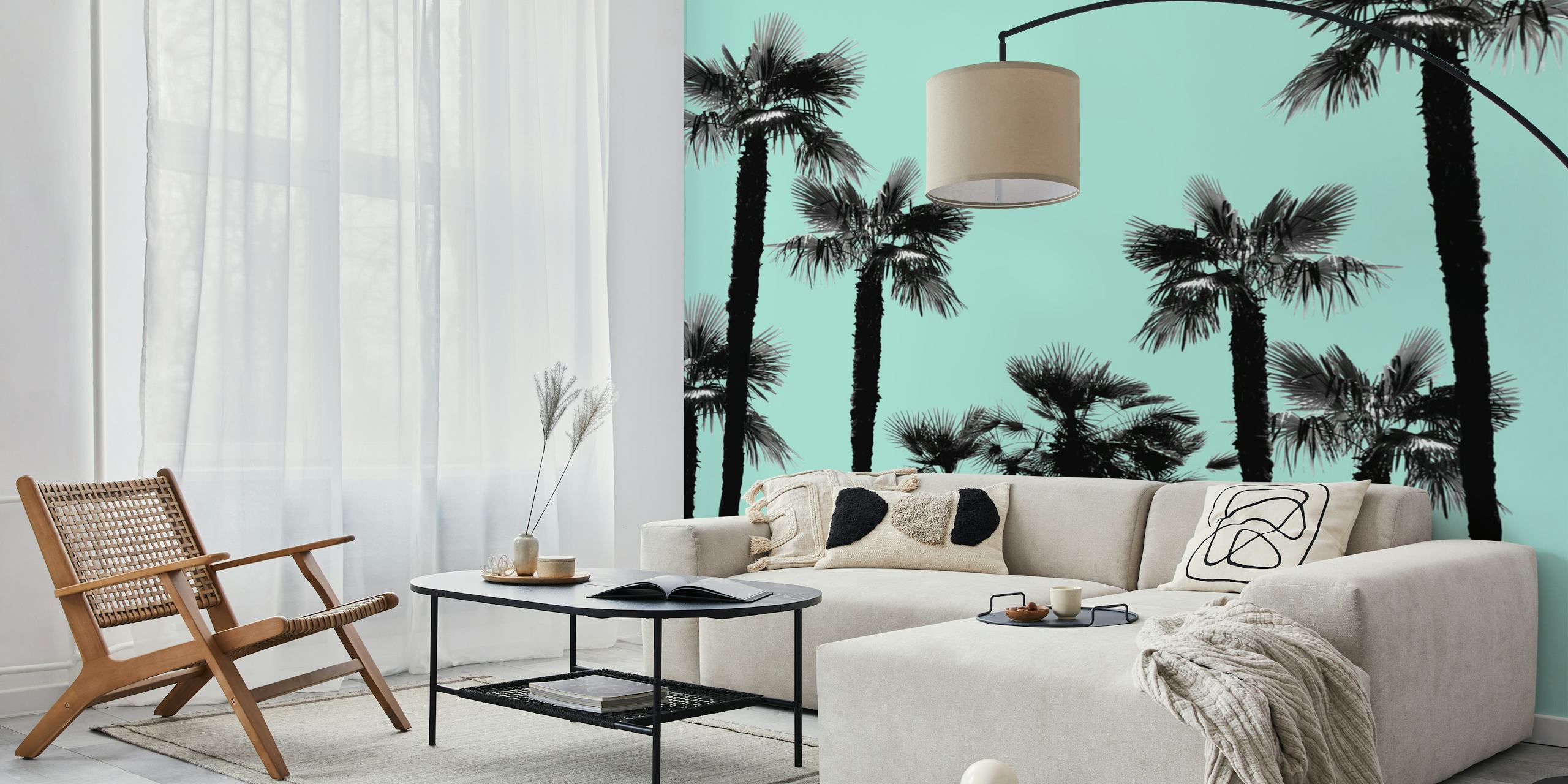 Silhouette of palm trees against a teal sky wall mural