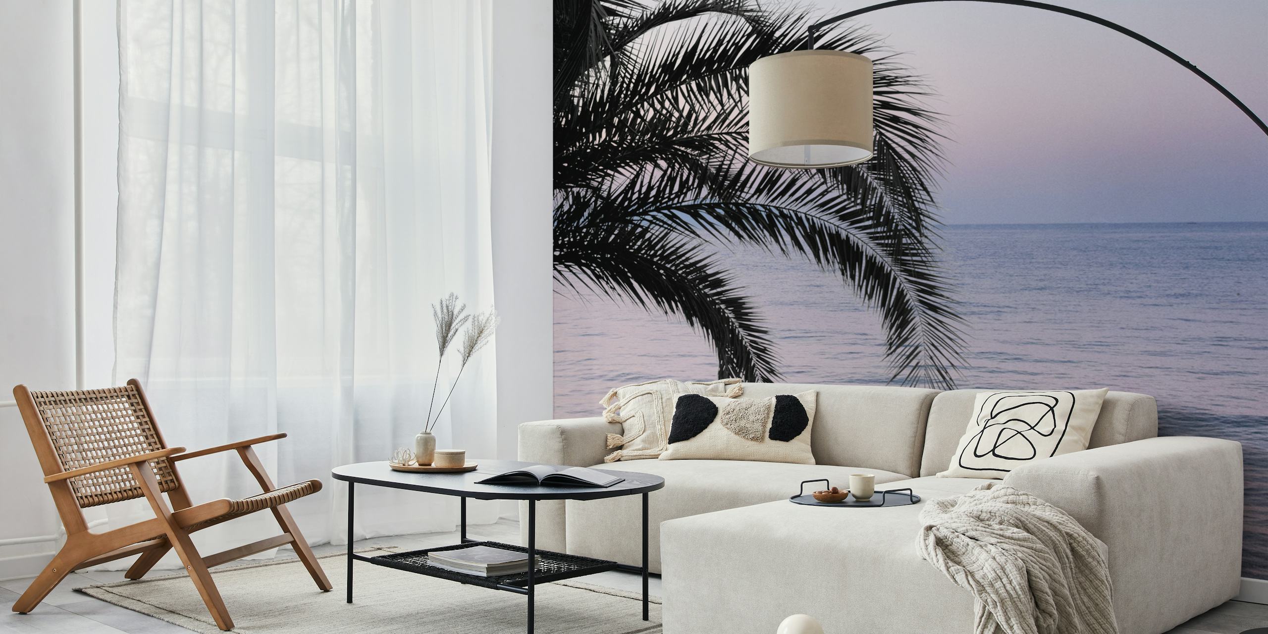 Tropical palm leaves over a soft ocean sunset wallpaper