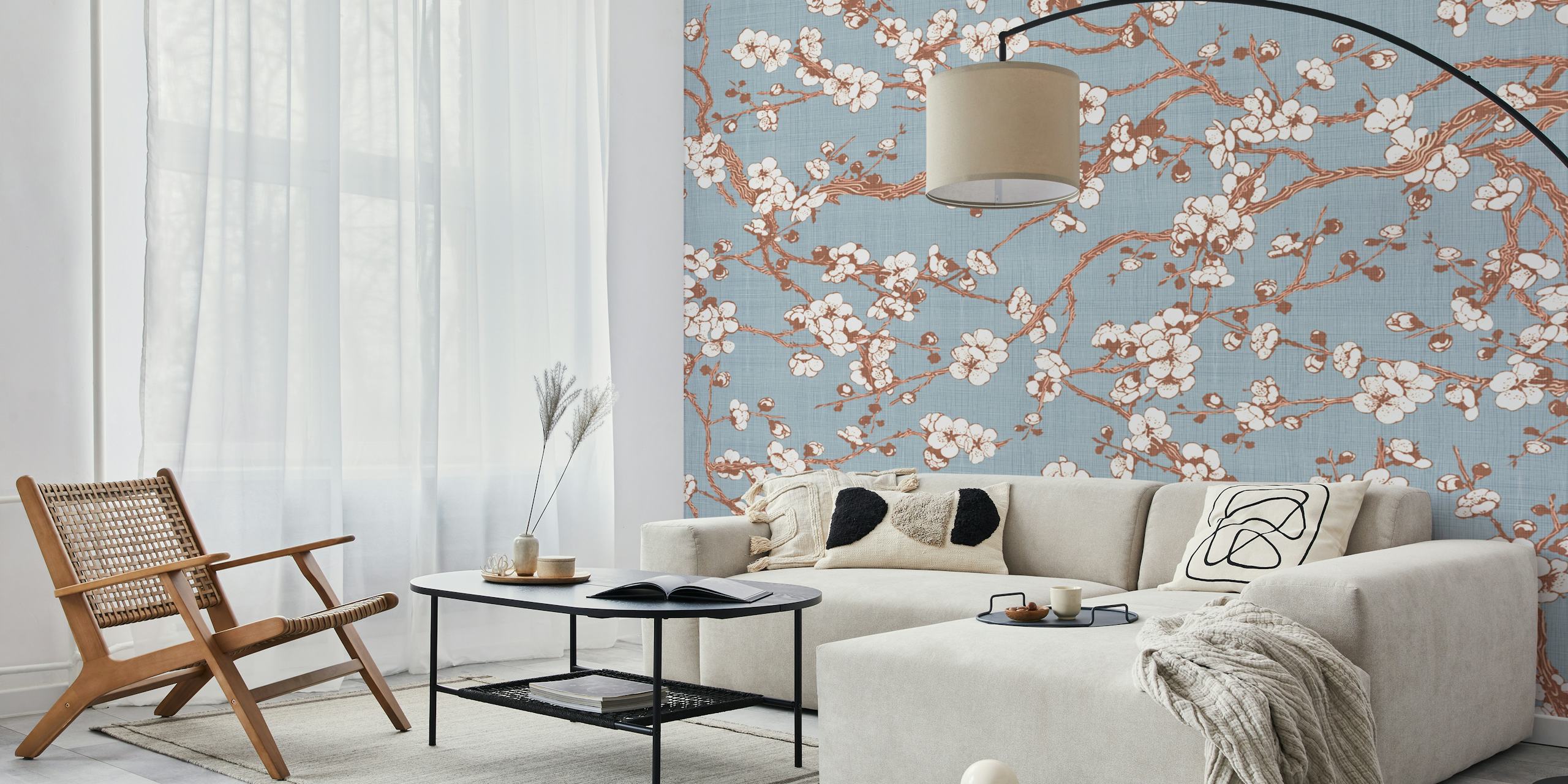 Sakura floral branches with white flowers on blue wallpaper