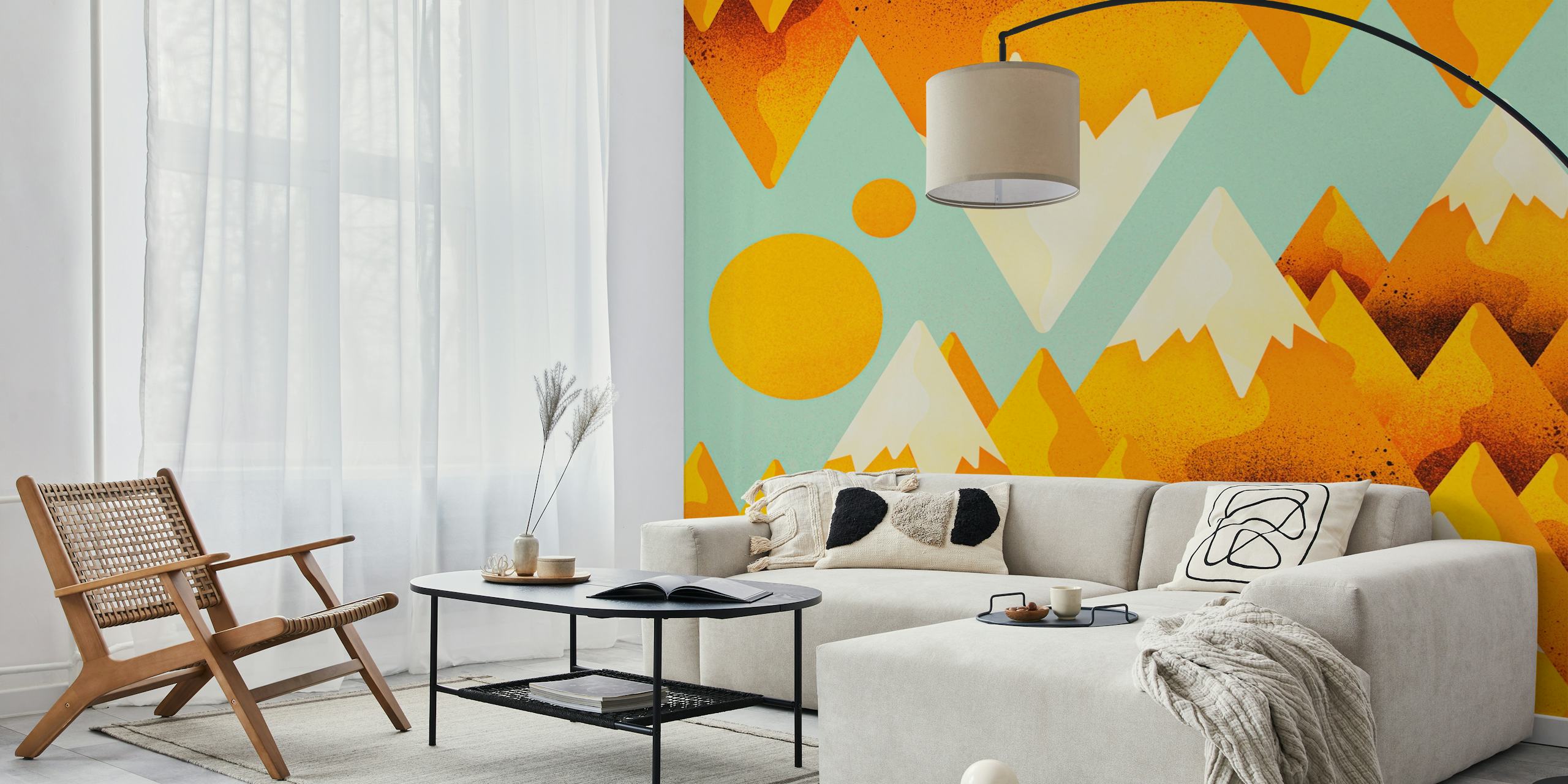 Yellow mountain peaks with white tips against a teal background wallpaper