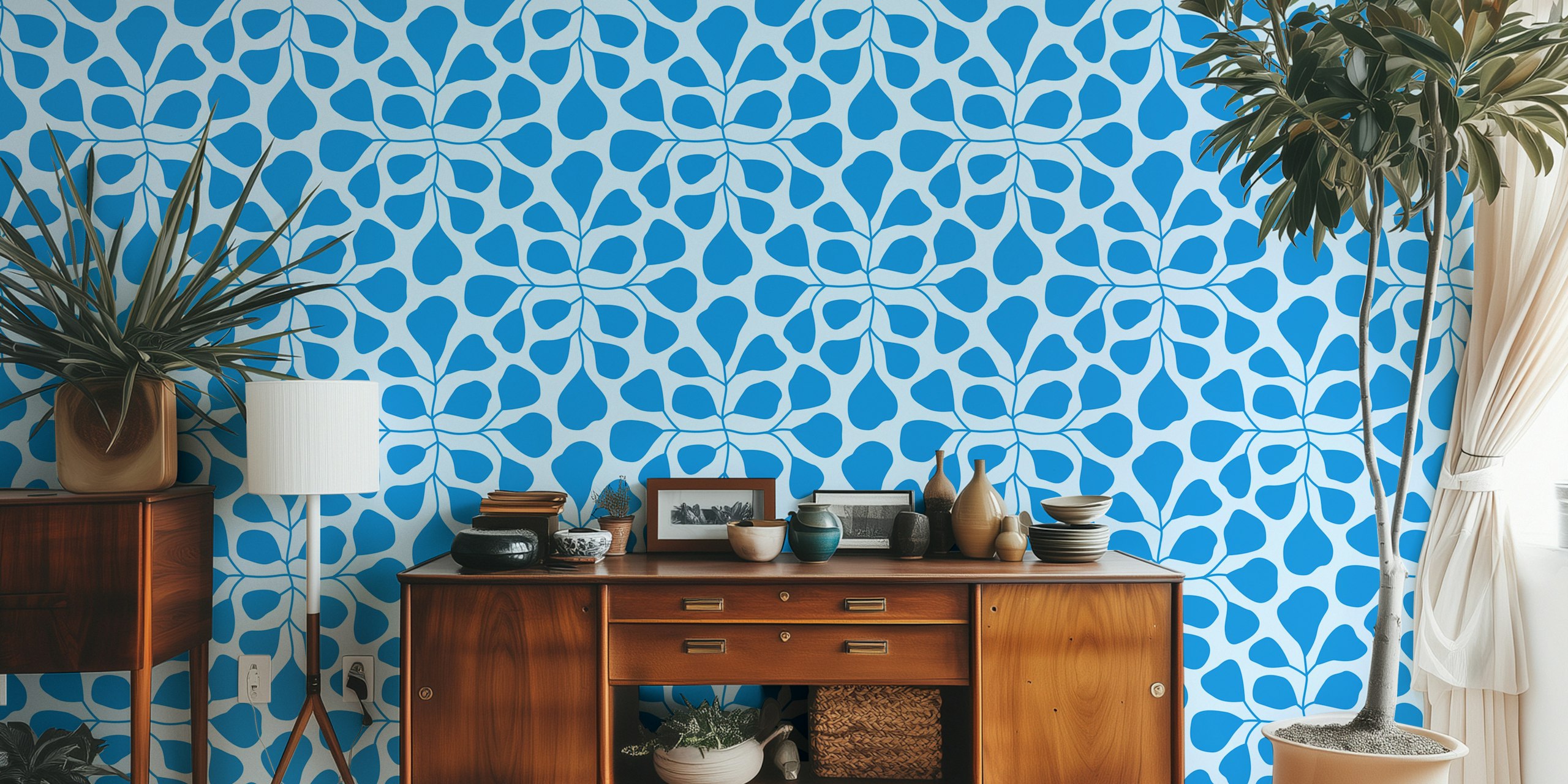 Large blue leaves pattern on light blue background wallpaper