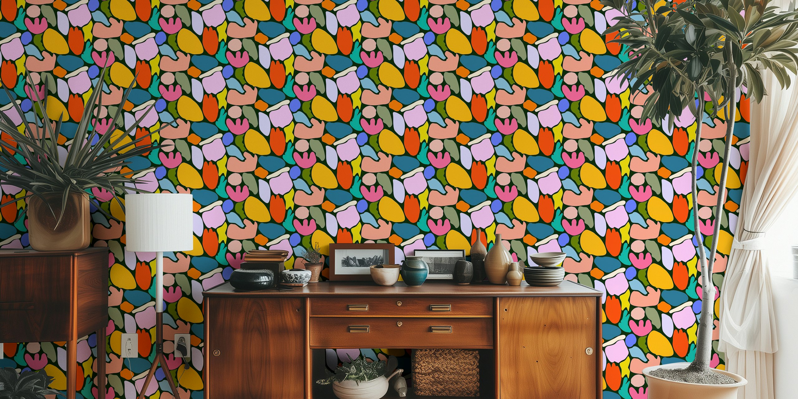 Abstract floral wall mural on a black background with colorful shapes