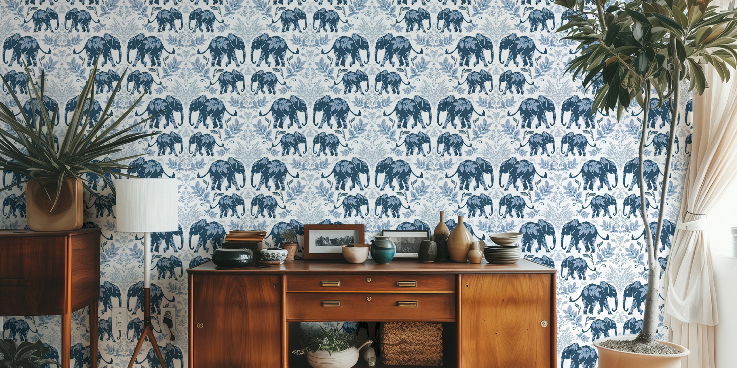 Blue elephants with leaves on white background wallpaper