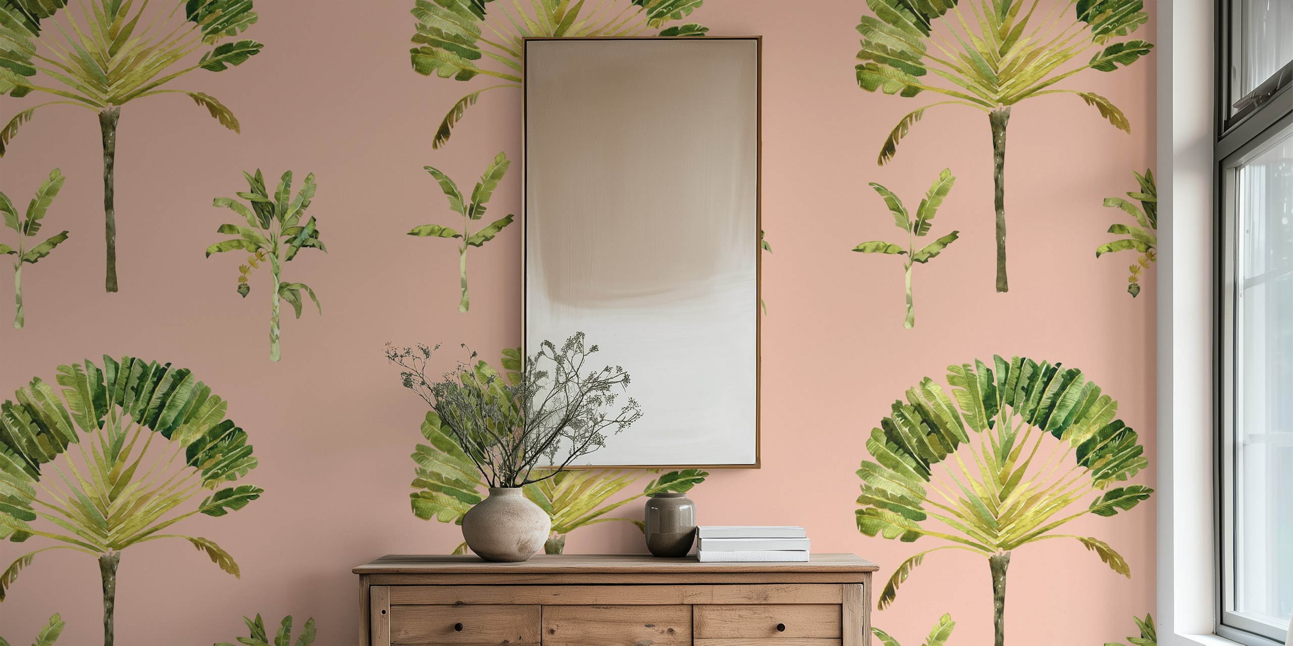 Tropical banana leaf shapes in shades of green on blush pink wallpaper