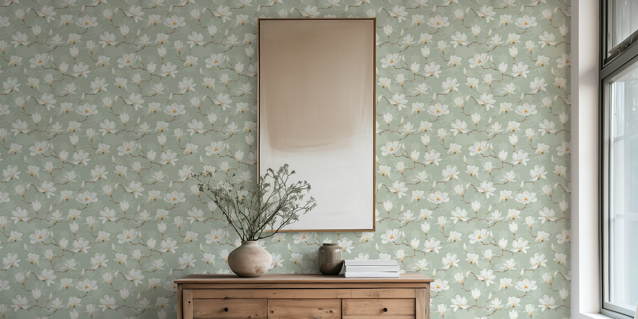 Magnolia flowers with branches on soft green wallpaper