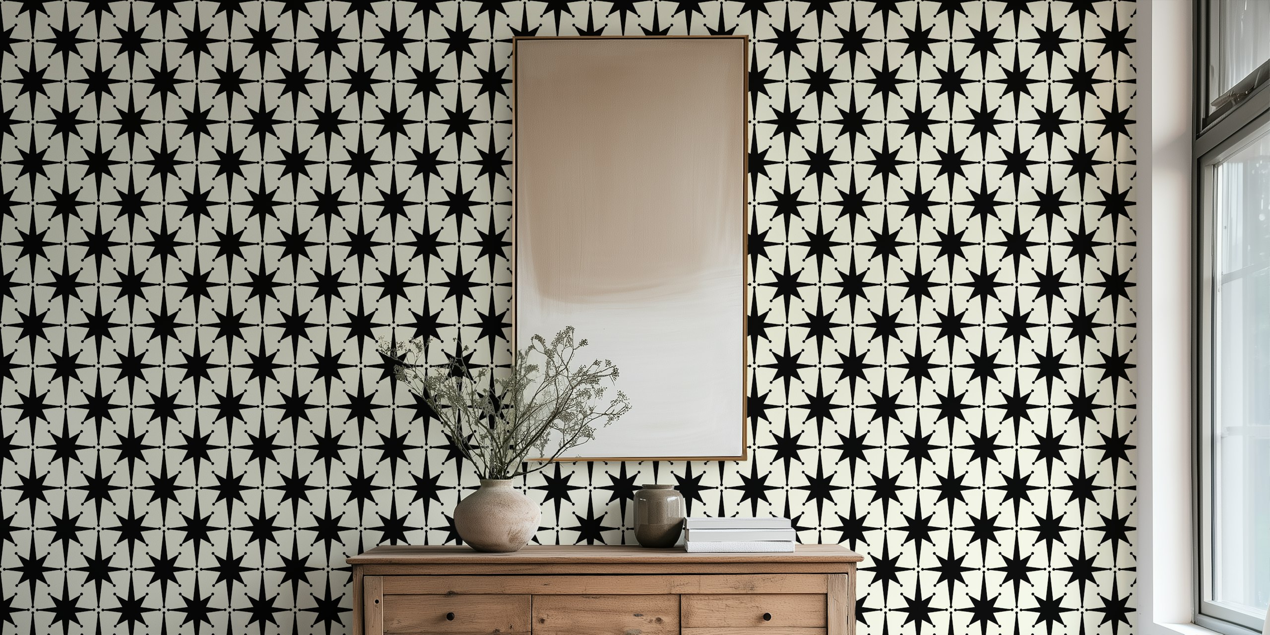 Black starburst shapes on cream background wallpaper