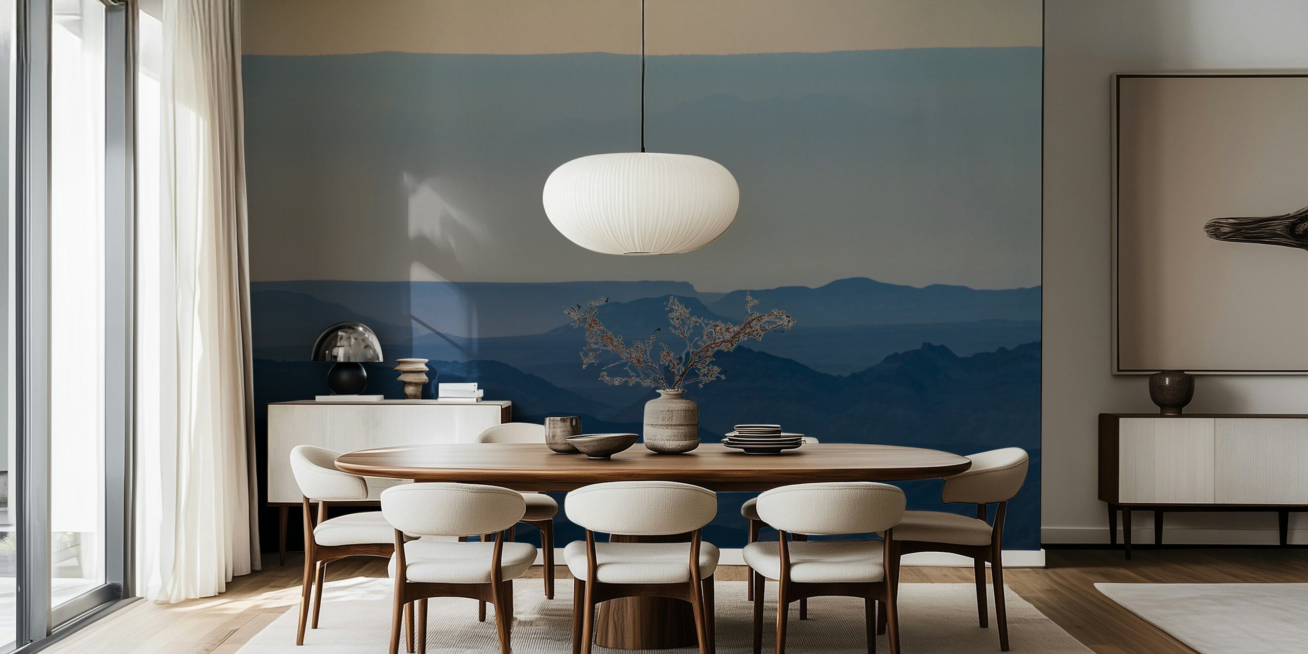 Landscape wallpaper featuring sunrise over mountains in soft blue hues