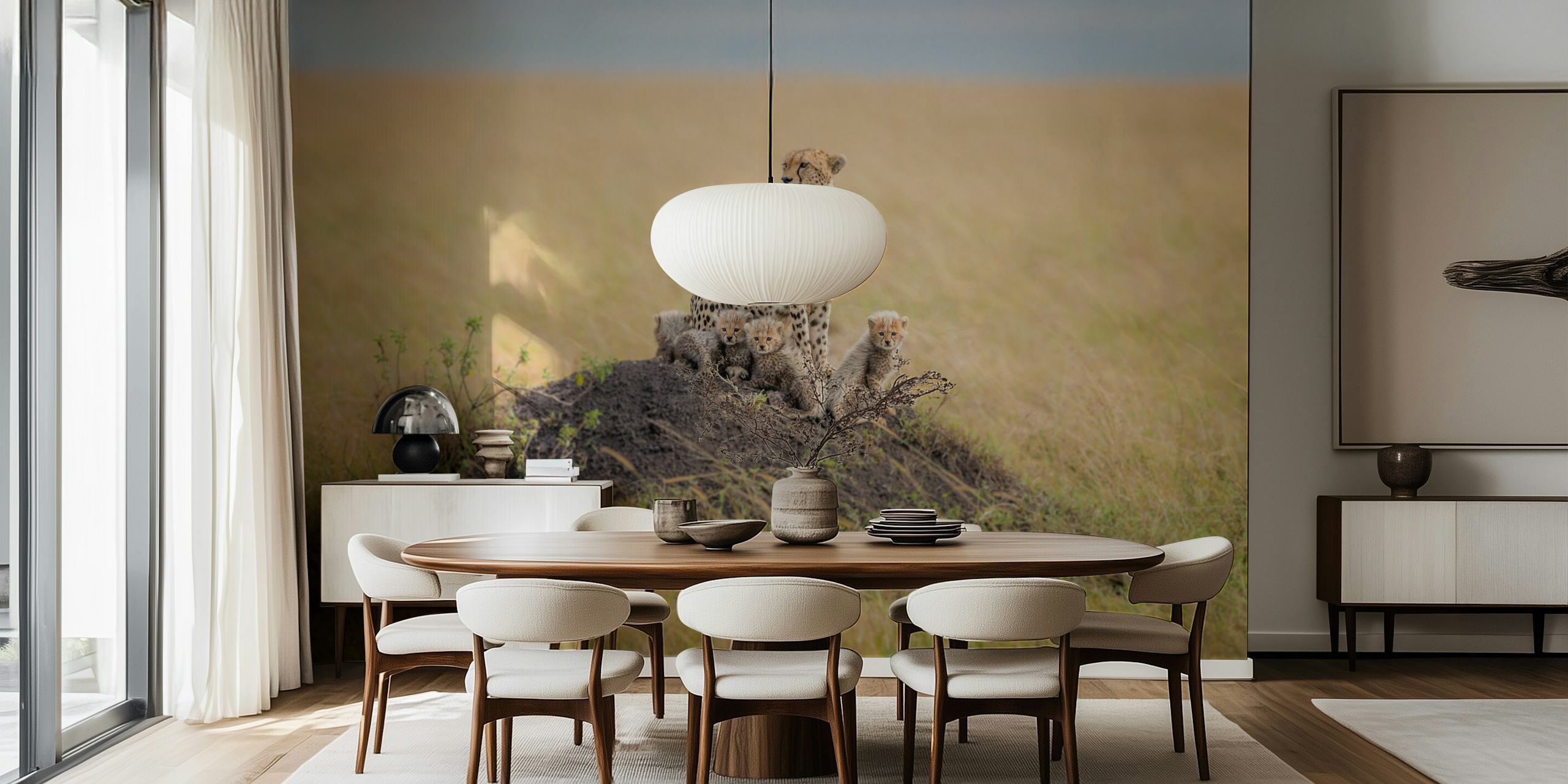 Cheetah with cubs on a mound in grassy landscape wallpaper