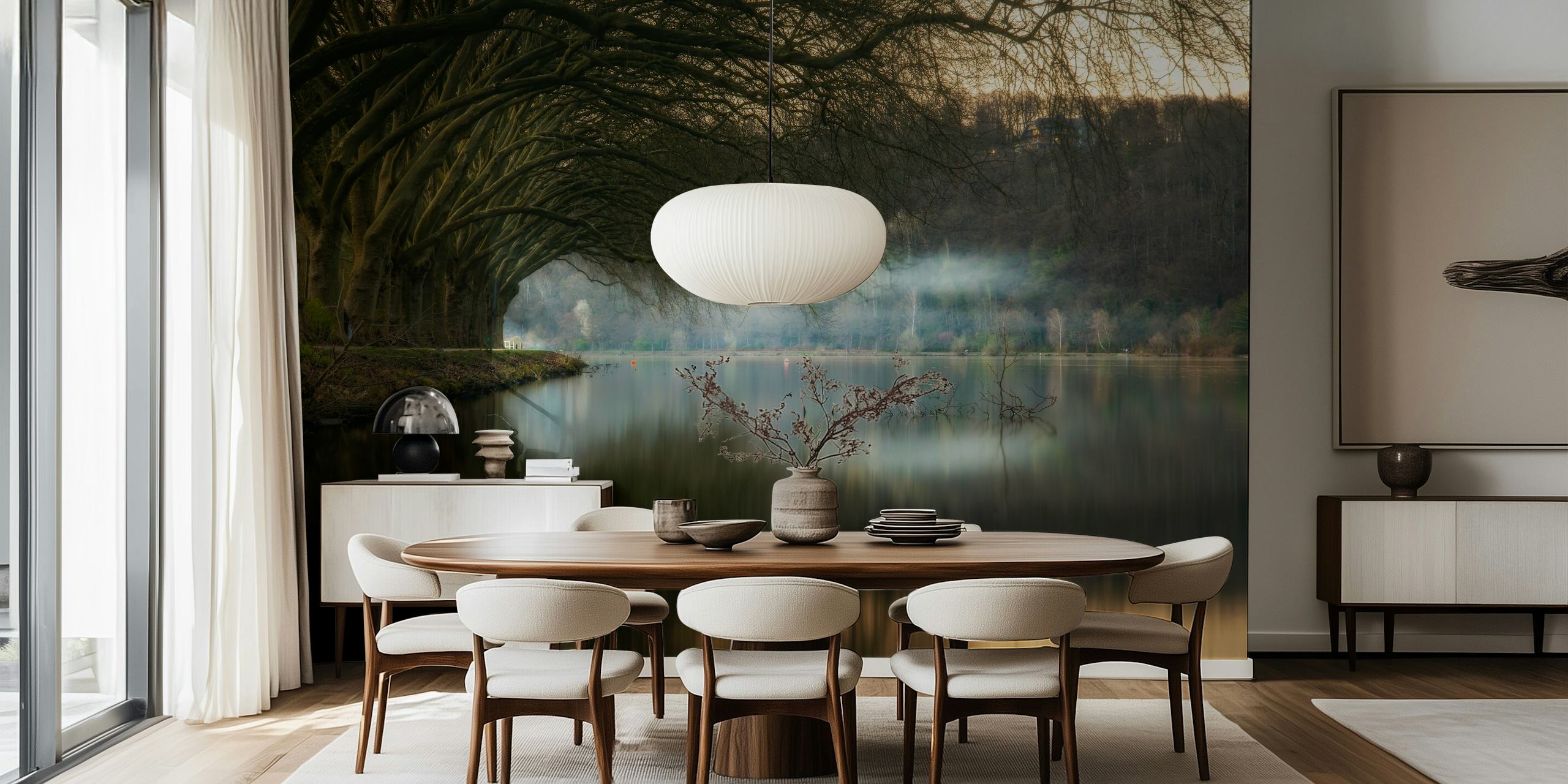 Misty lakeside wall mural with trees reflecting on calm water.