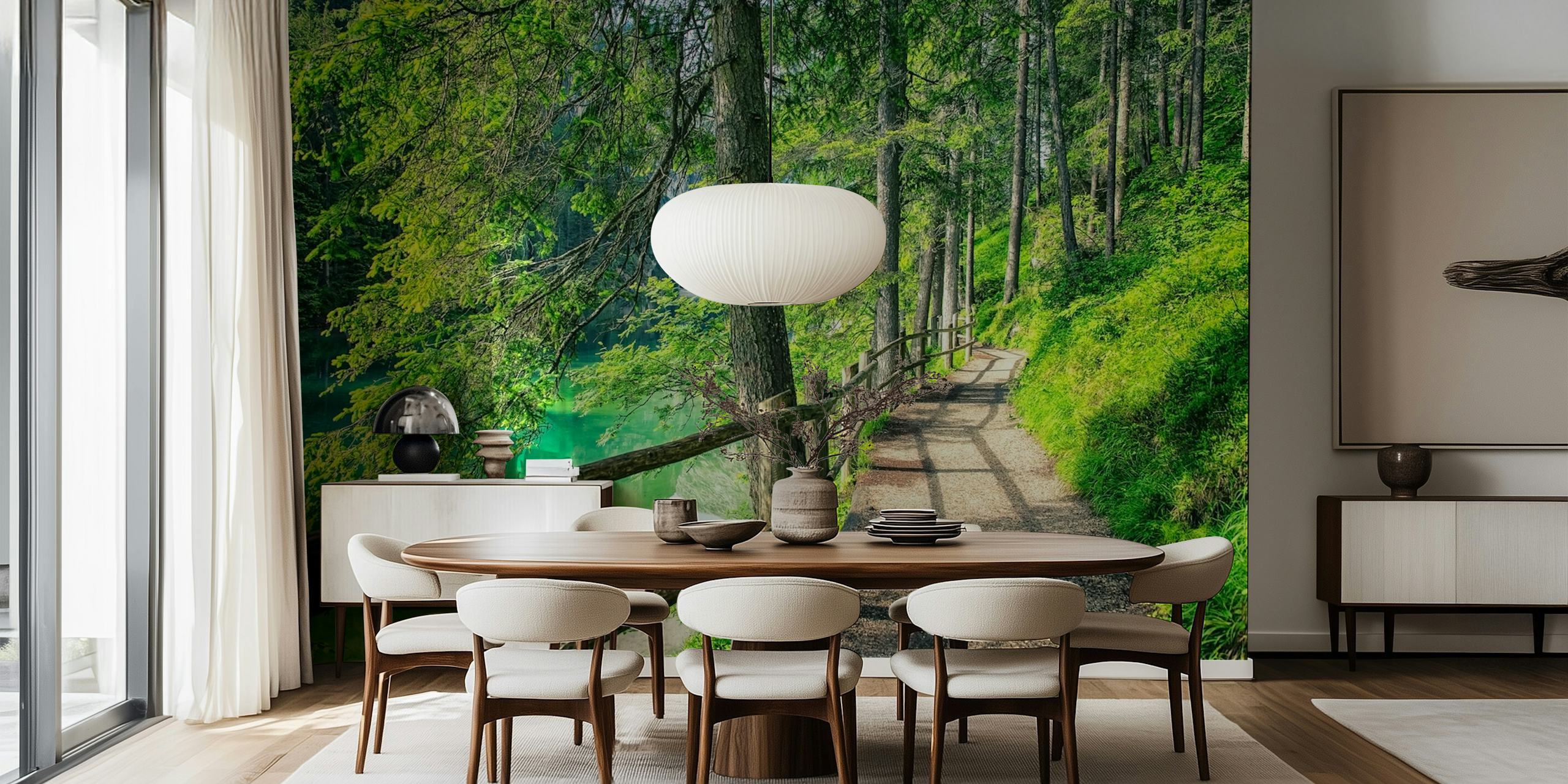 Scenic forest path with green trees and tranquil water wallpaper