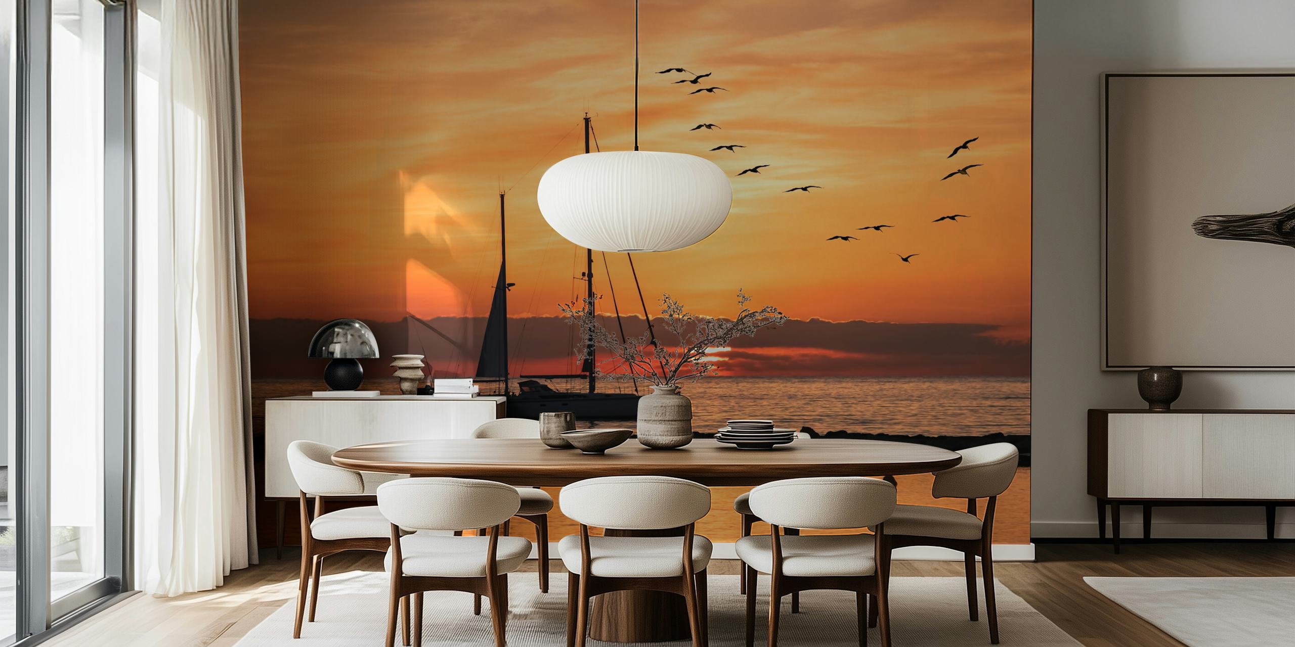 Sailboat silhouette against a sunset backdrop with flying birds over the sea wall mural