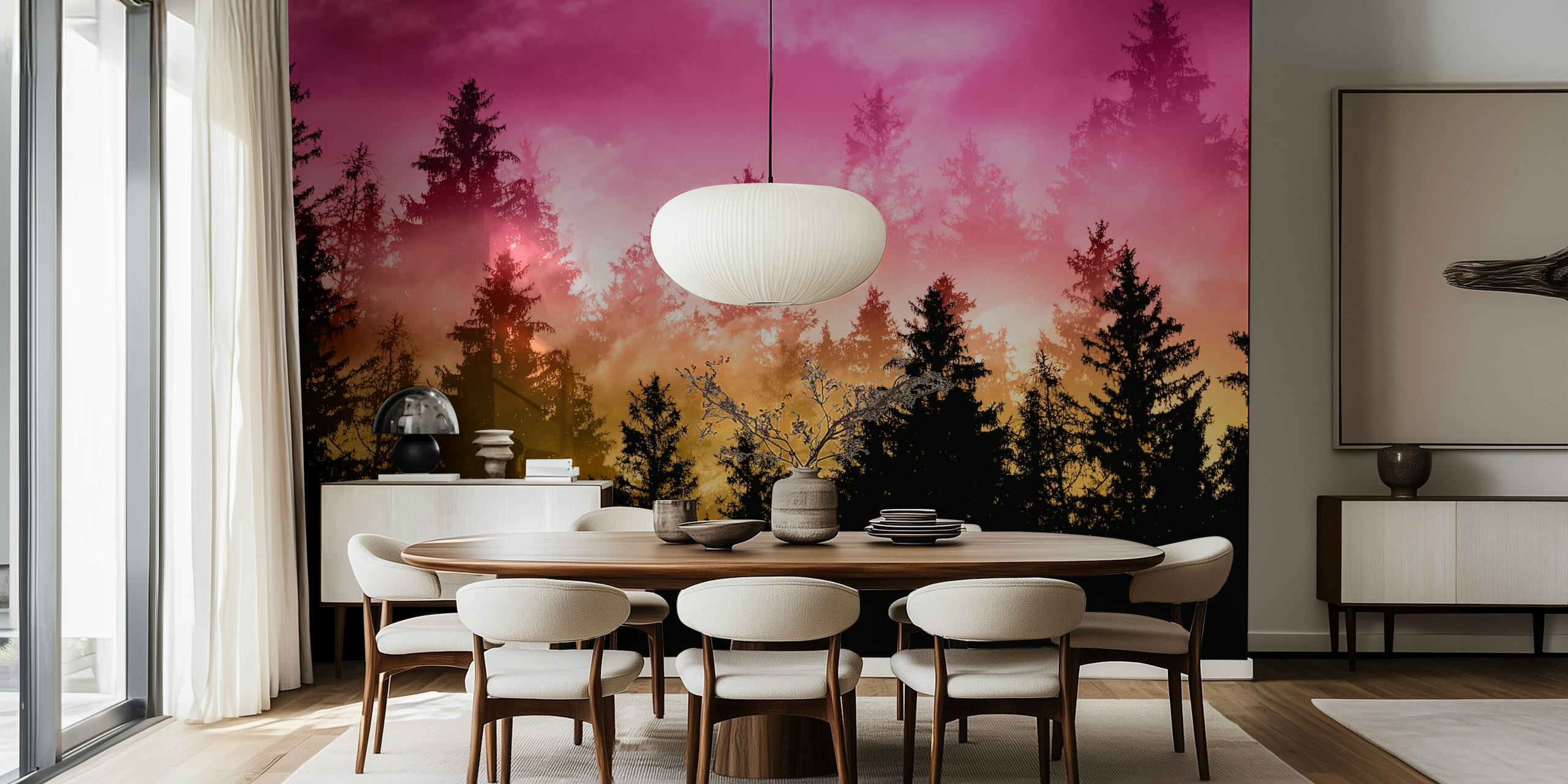 Silhouetted dark trees against a pink to orange ombre sunset wallpaper