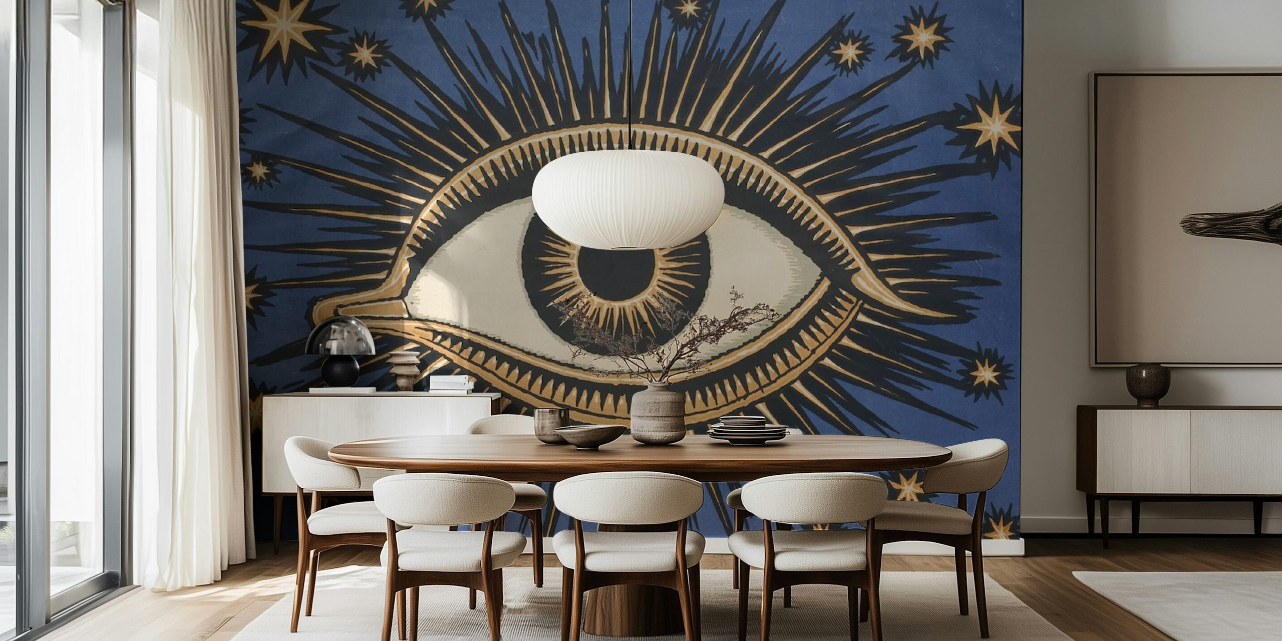 Celestial eye design with golden rays on blue background wallpaper