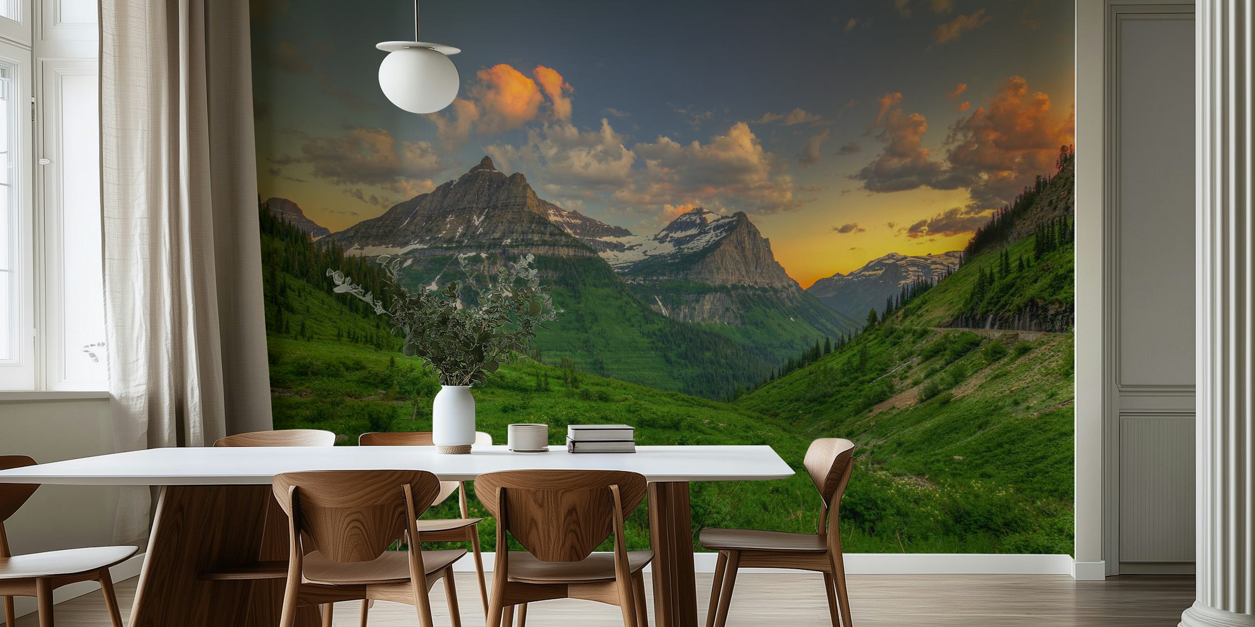 Mountain sunset with orange clouds and green valleys wallpaper