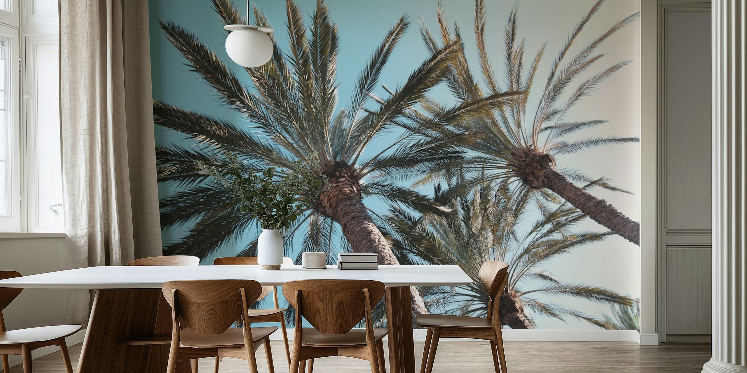 Palm trees with green leaves on a blue background wallpaper