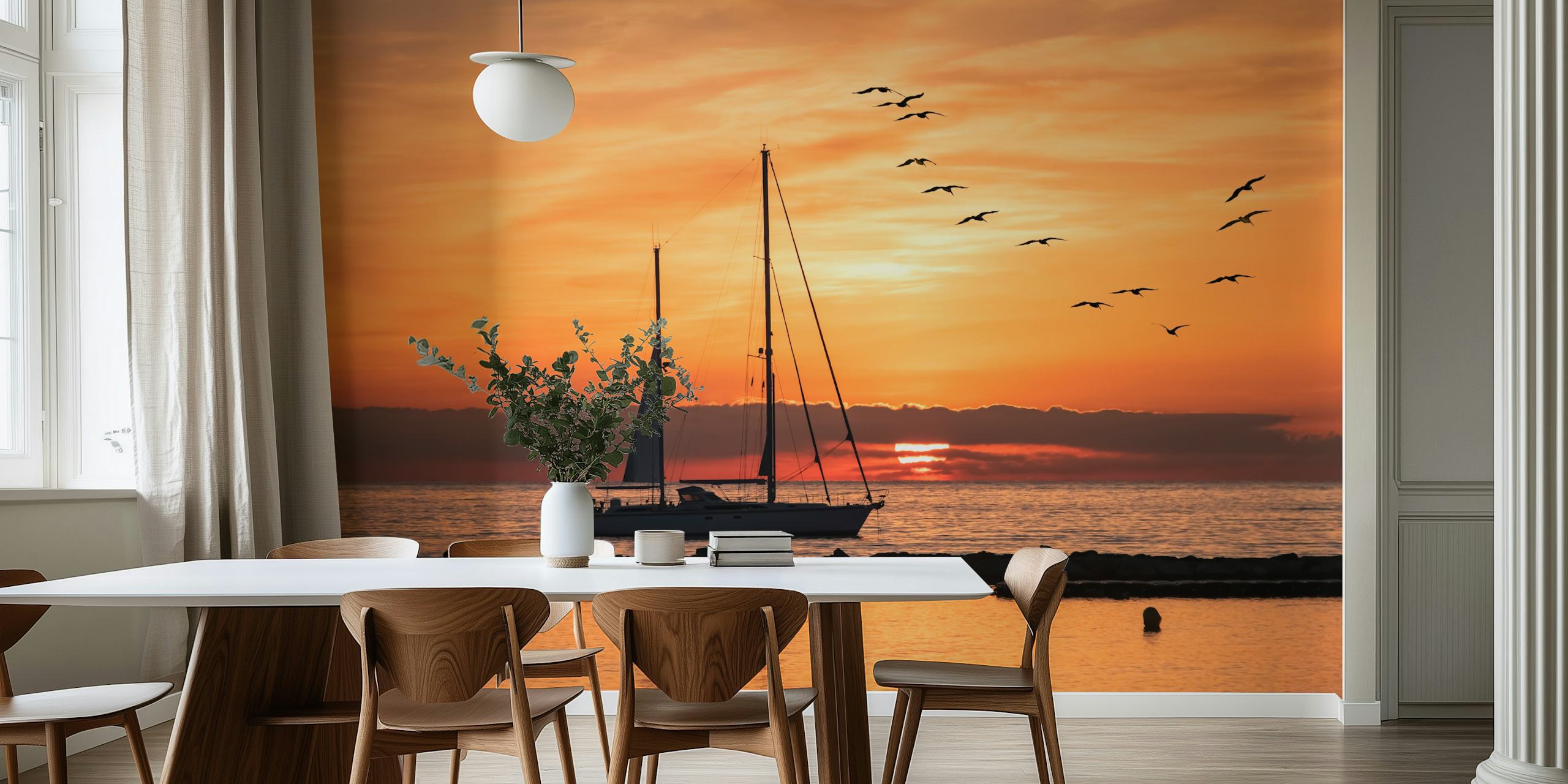 Sailboat silhouette against a sunset backdrop with flying birds over the sea wall mural