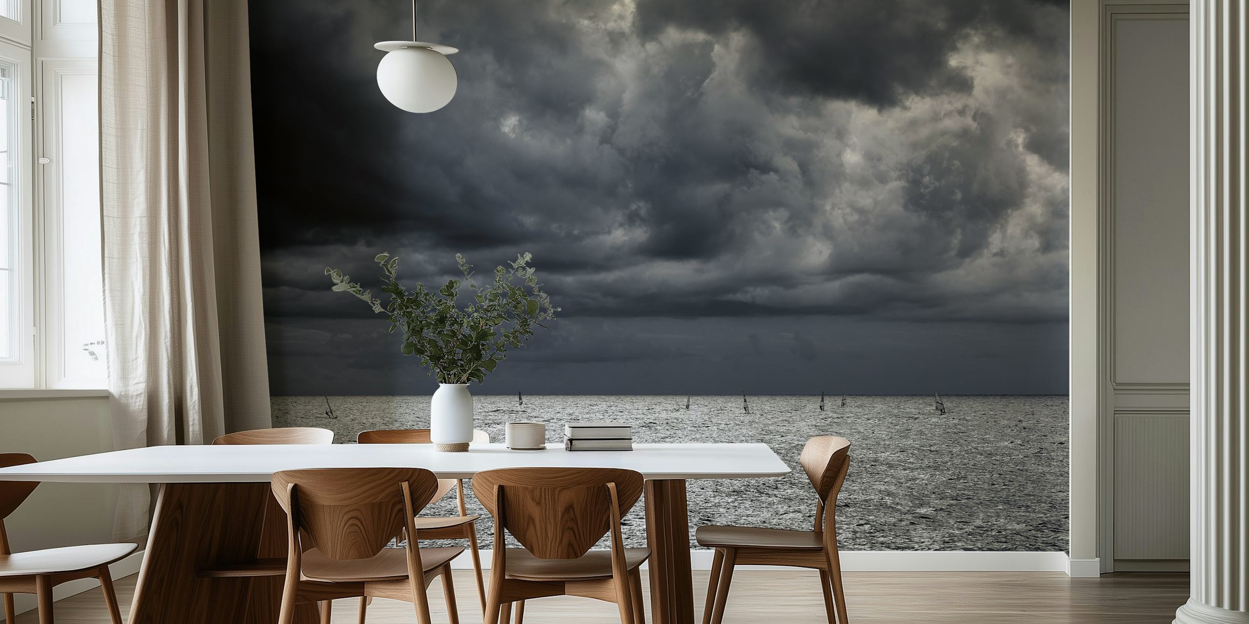 Moody seascape with cloudy sky over a shimmering ocean wall mural