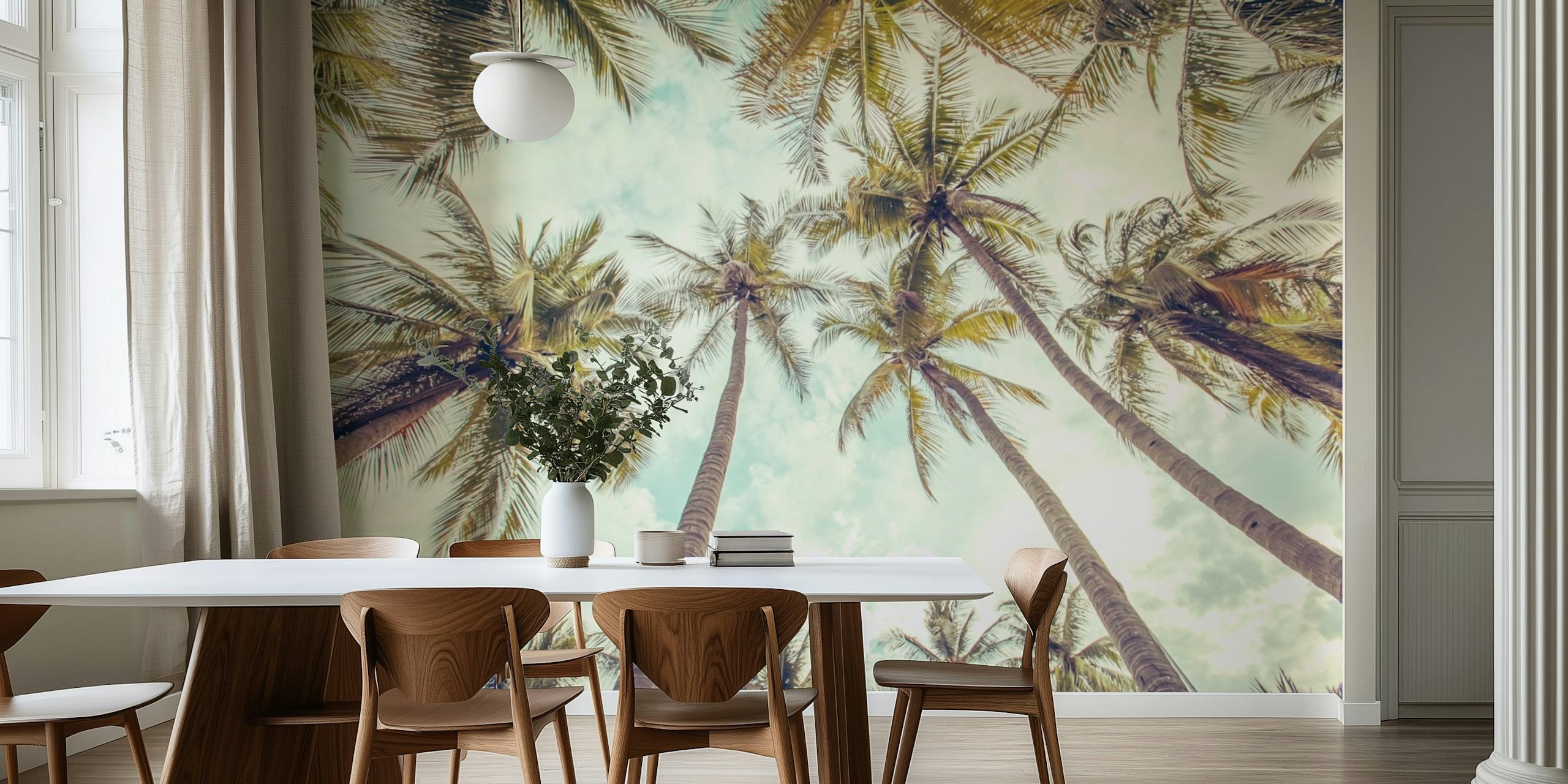 Palm trees under a blue sky with soft clouds wallpaper