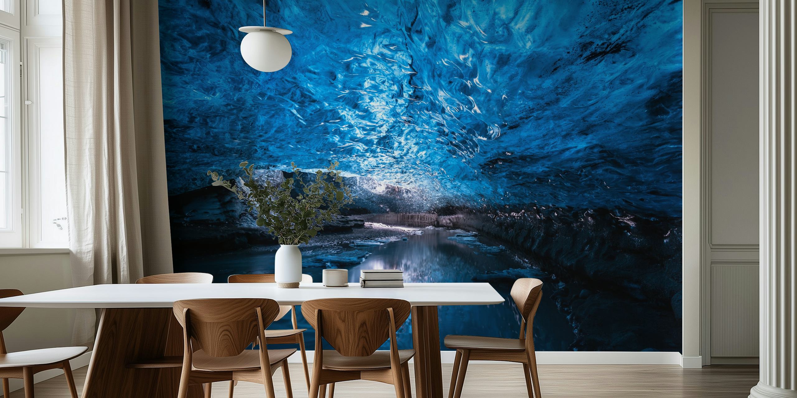 Ice cave with blue lighting and water reflection wallpaper
