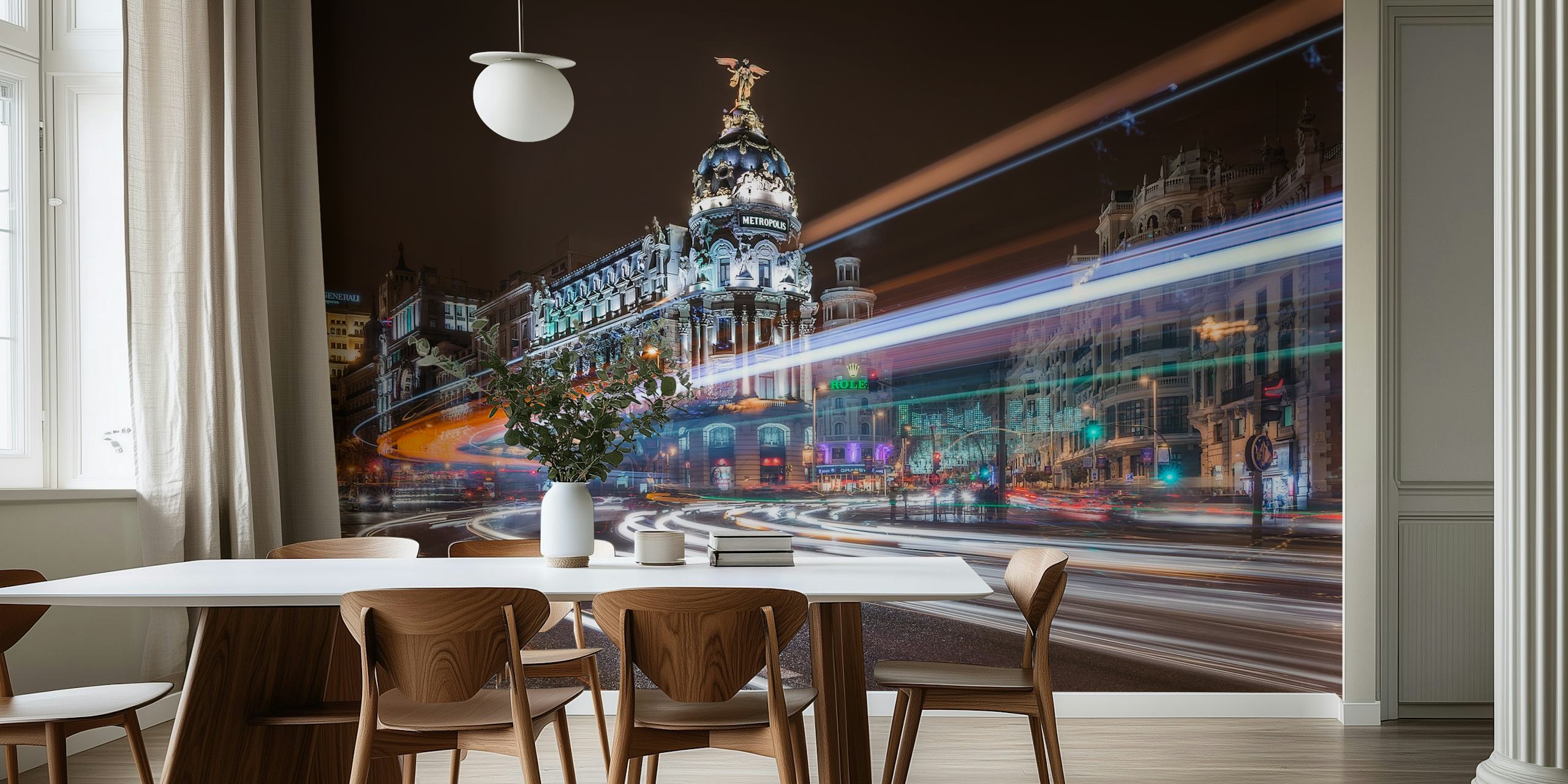 Nighttime city traffic with vibrant light trails and historic buildings wallpaper