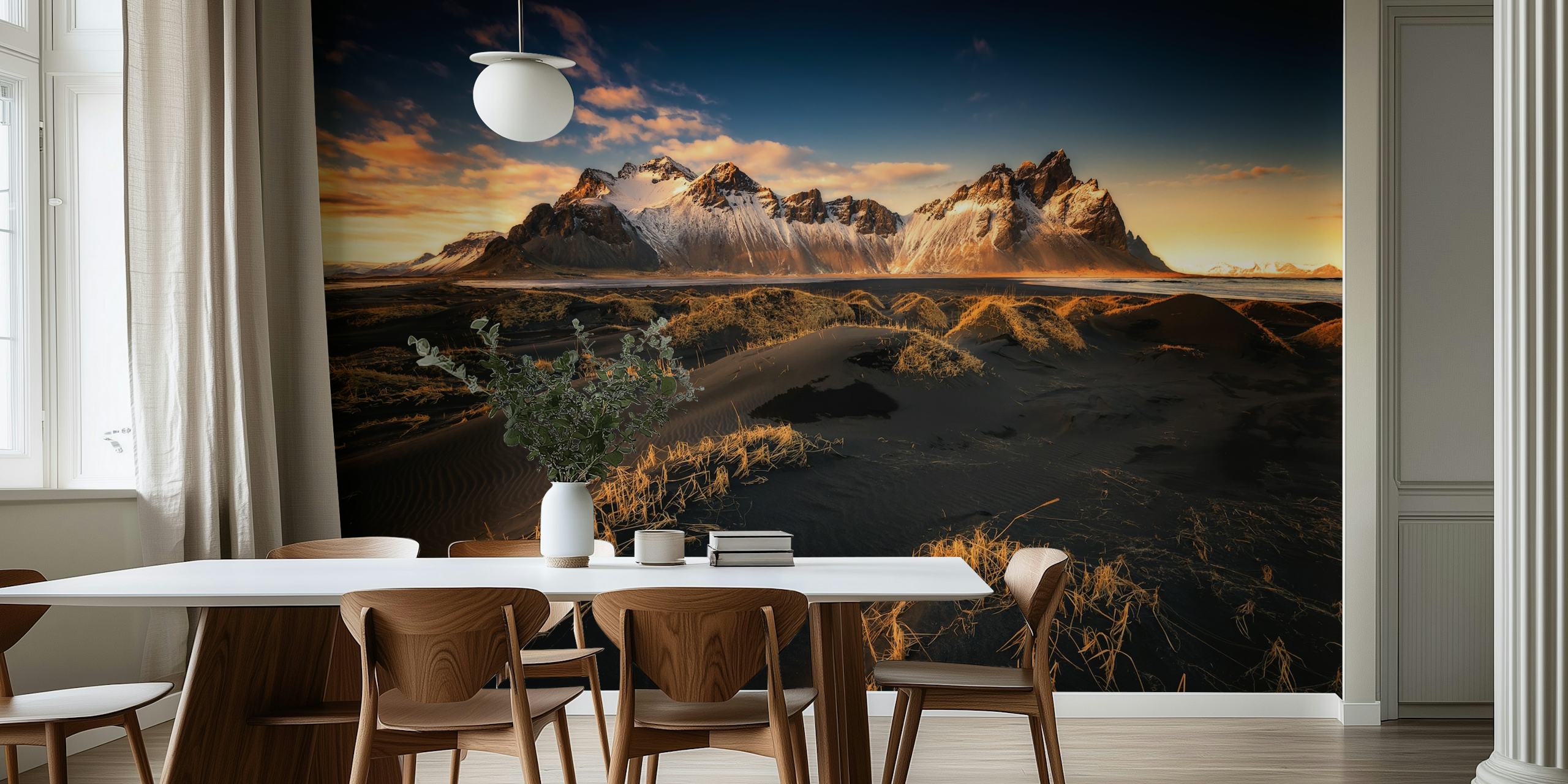 Icelandic landscape with snow-capped mountains and golden sunset hues wall mural