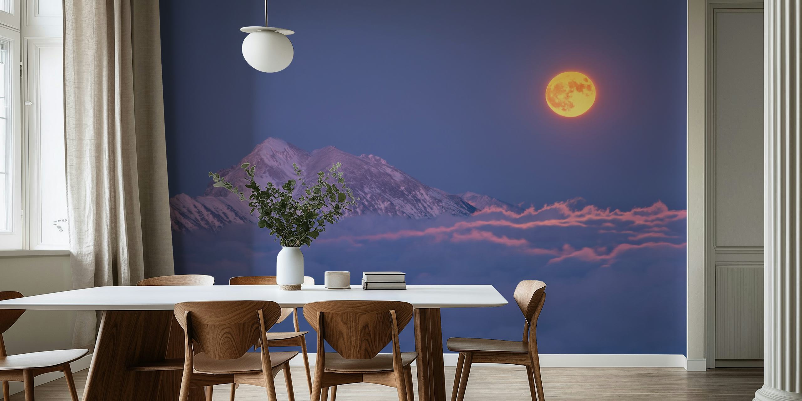 Glowing moon above snow-capped mountains and clouds wallpaper