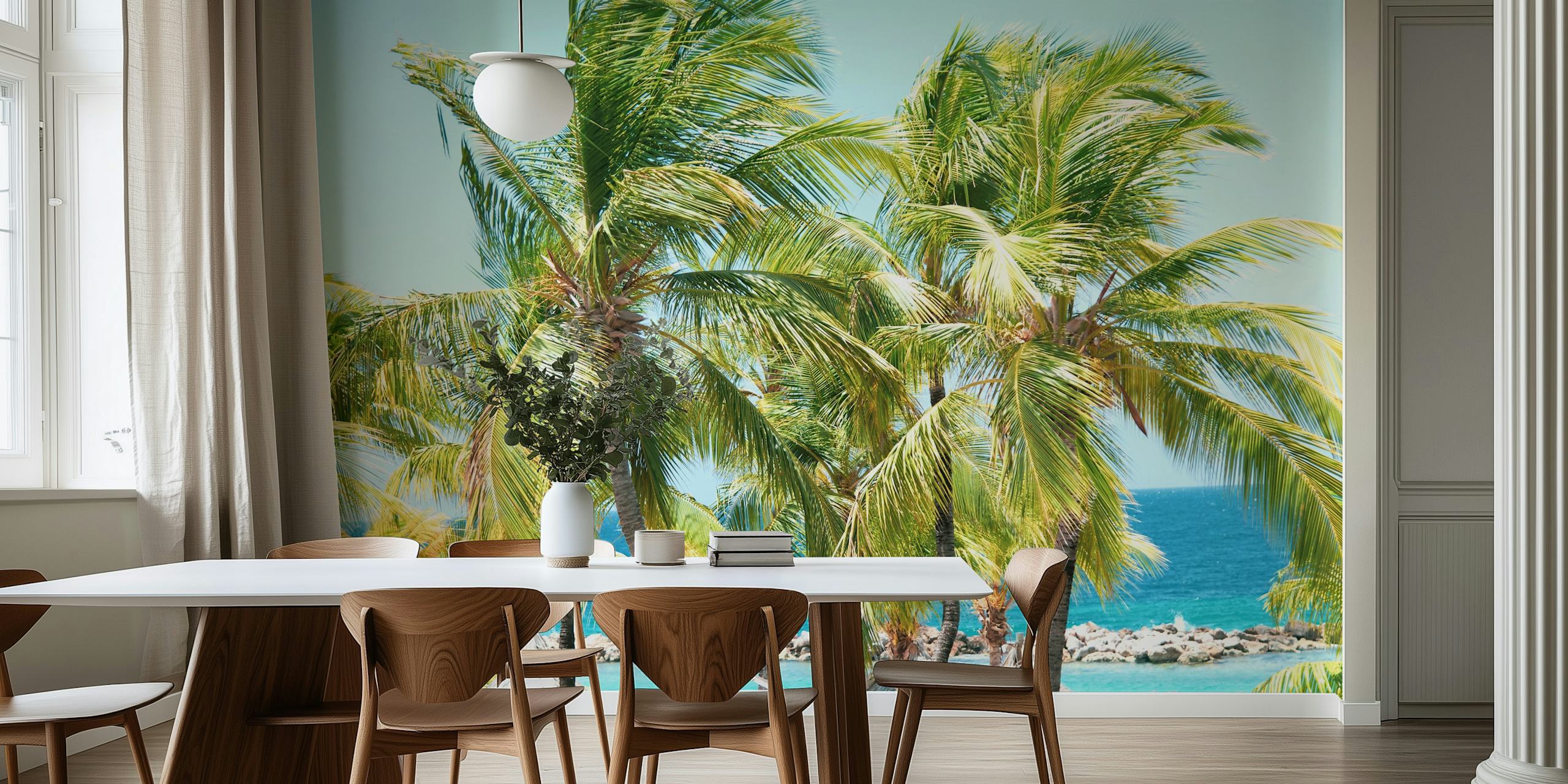 Tall green palm trees against a bright blue ocean wallpaper
