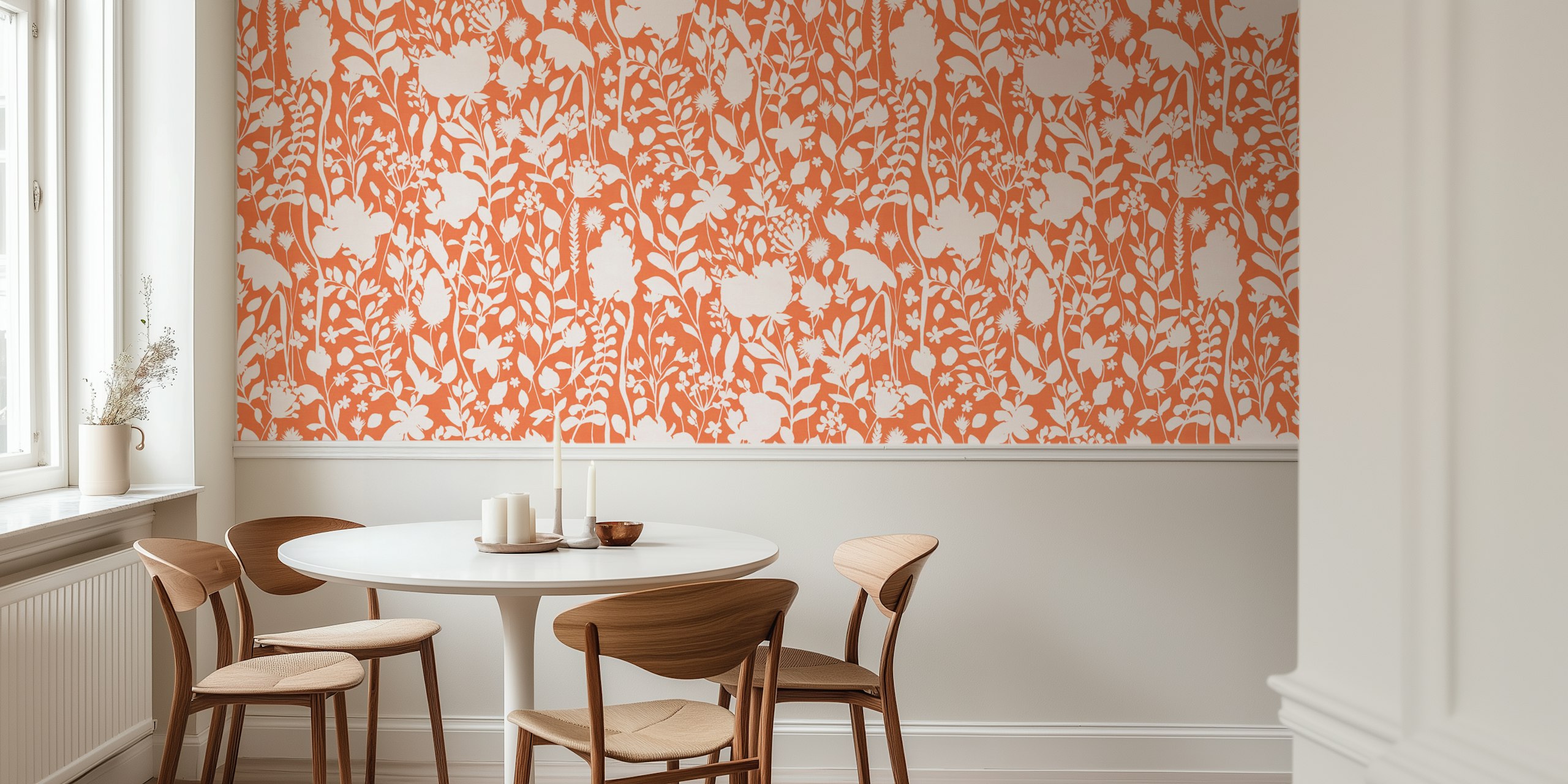 Floral silhouettes in white against an orange background wallpaper