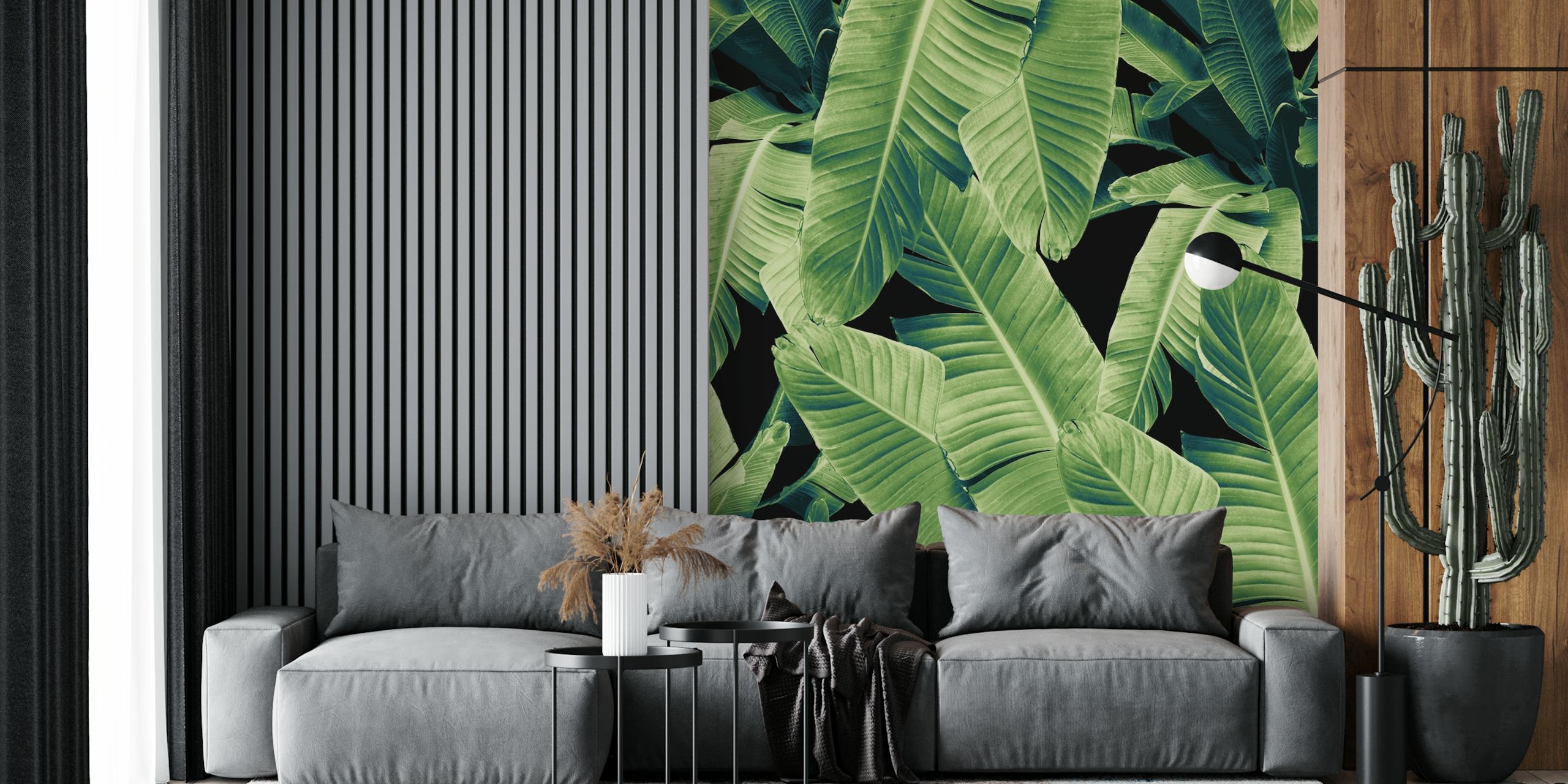 Tropical green banana leaves on black background wallpaper
