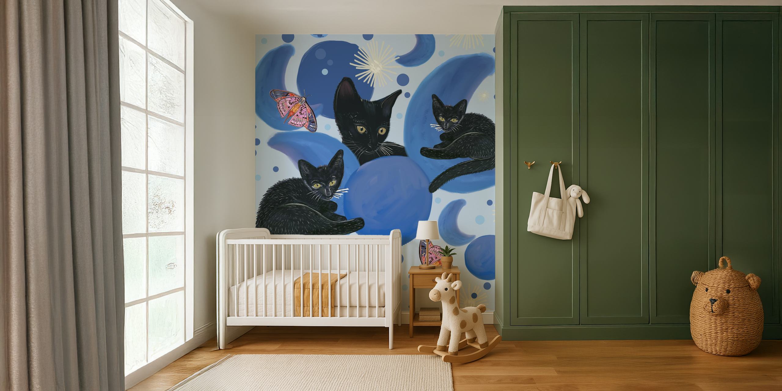 Svarta katter varvat med månfaser och stjärnor på en väggmålning