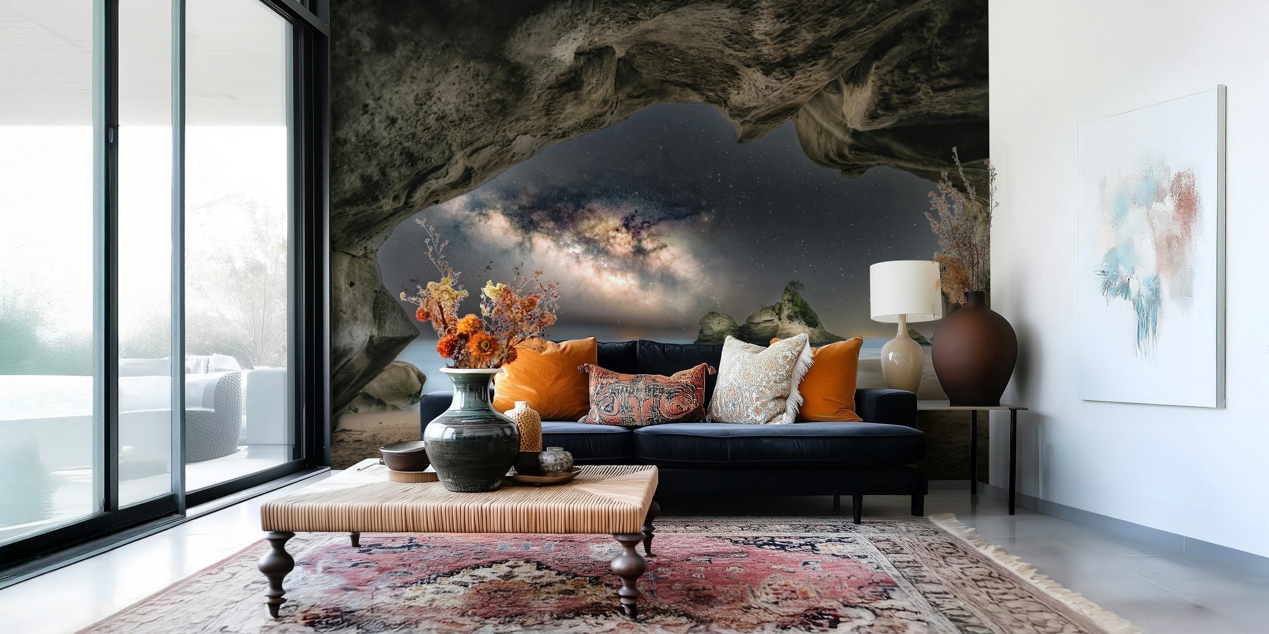 Rocky cave with starry night sky and ocean wallpaper