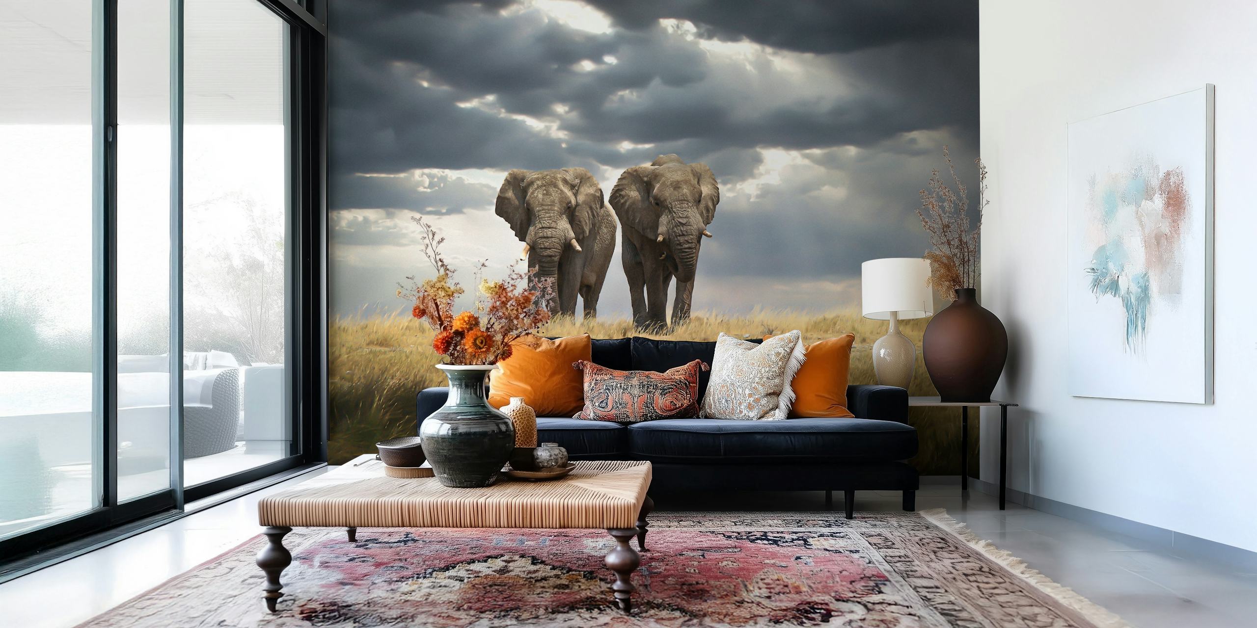 Elephants standing in a grassland under cloudy sky wallpaper