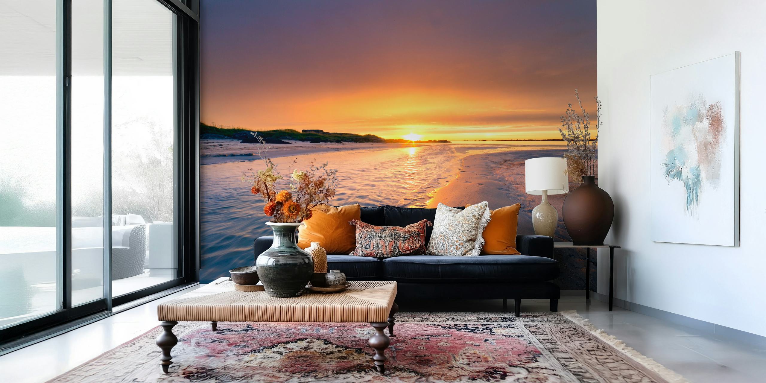 A tranquil beach scene at sunset with footprints in the sand wall mural.