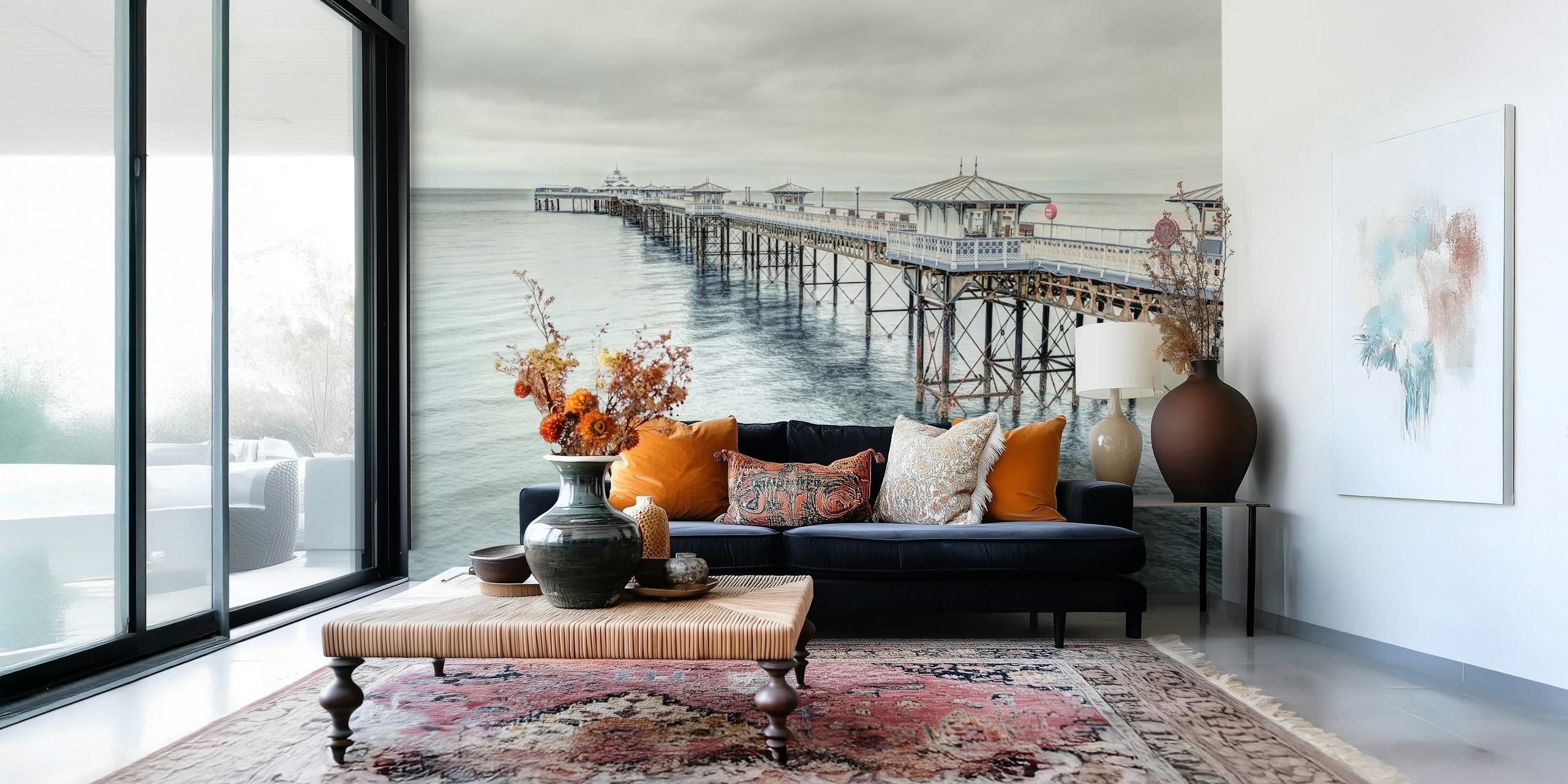 Coastal landscape wallpaper featuring Llandudno pier in muted greys and blues, realistic photography style.