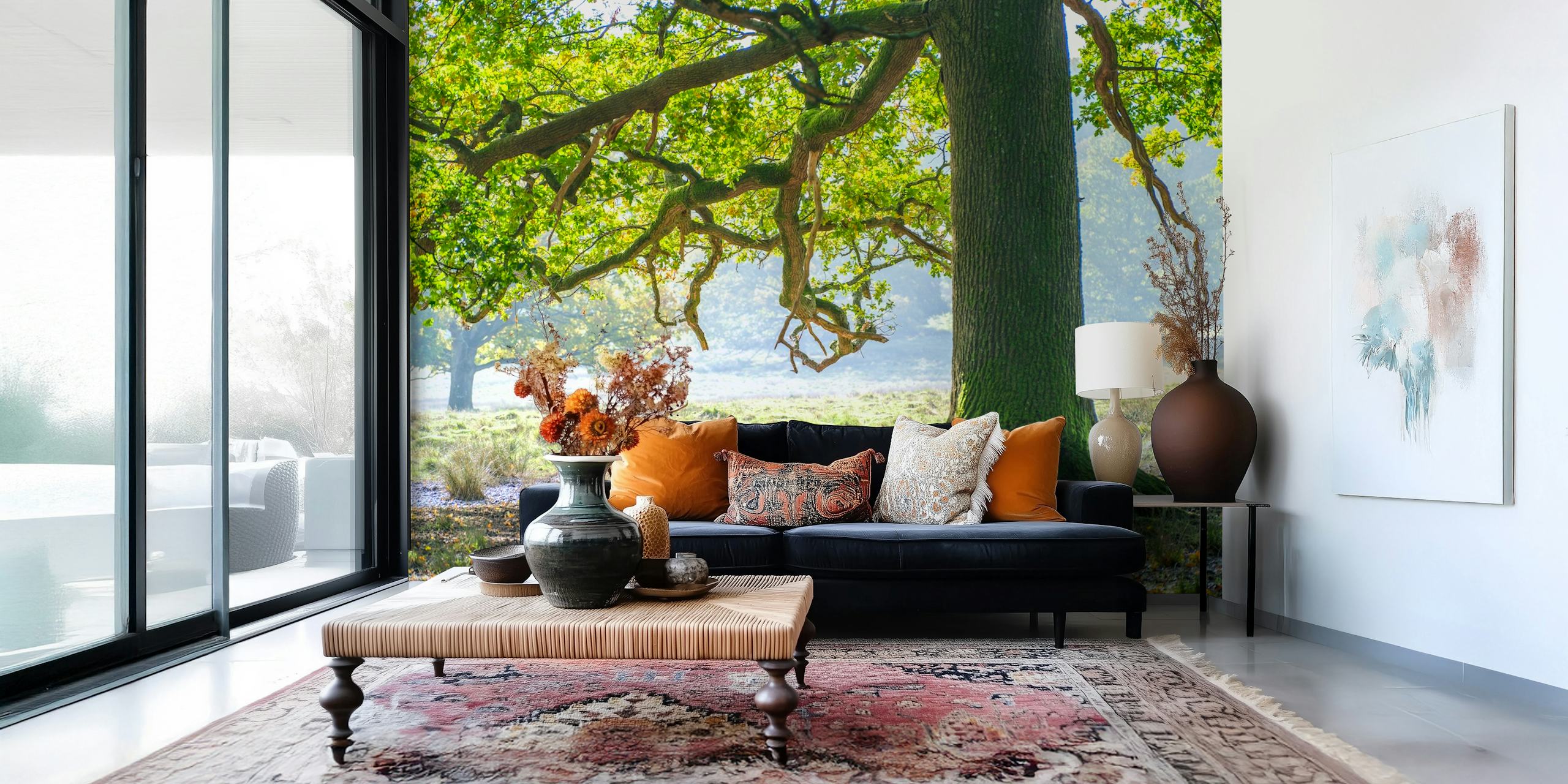 Stag standing under a large oak tree with green foliage wallpaper