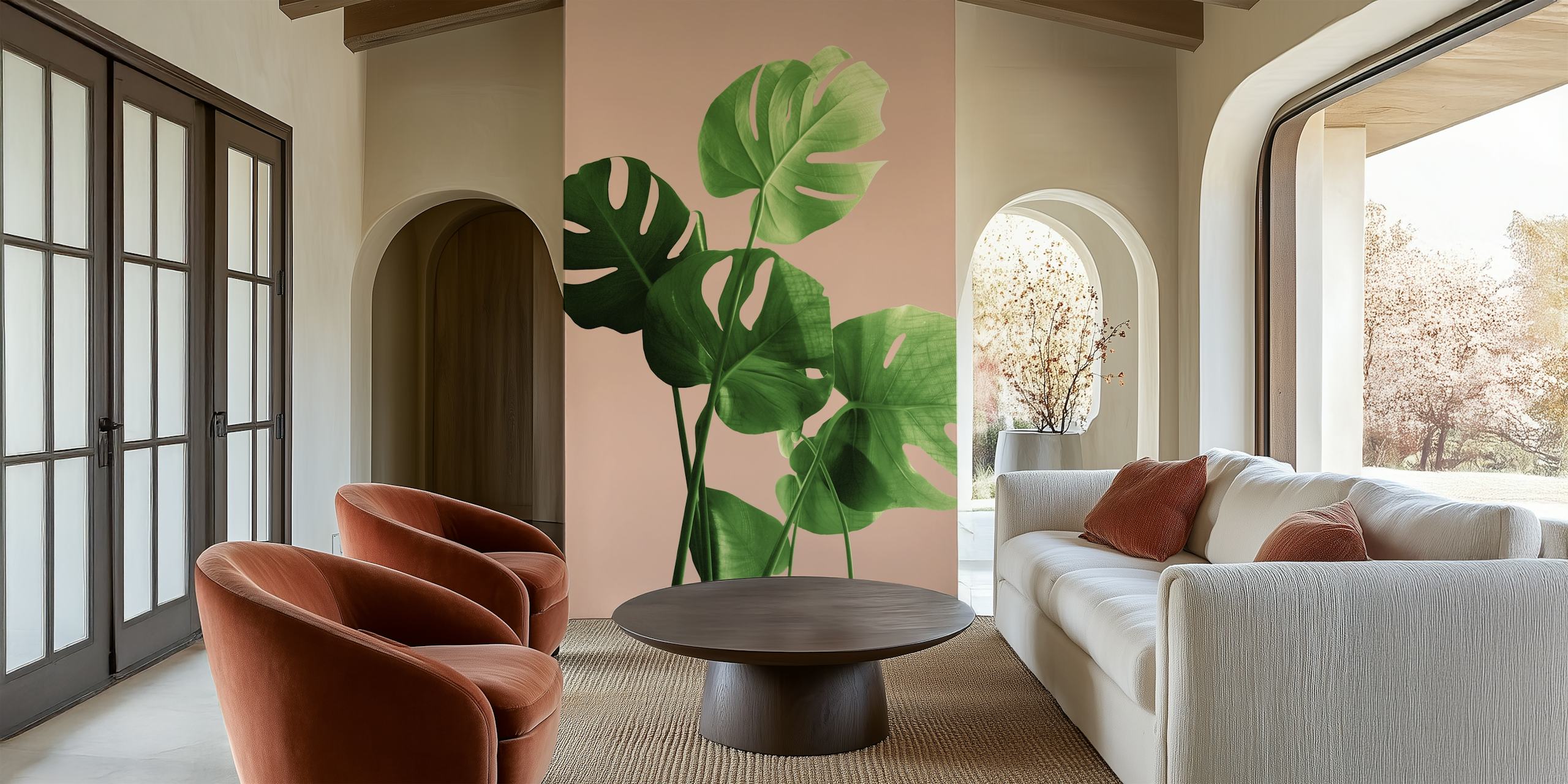 Tropical monstera leaves in green on a pale terracotta background wallpaper