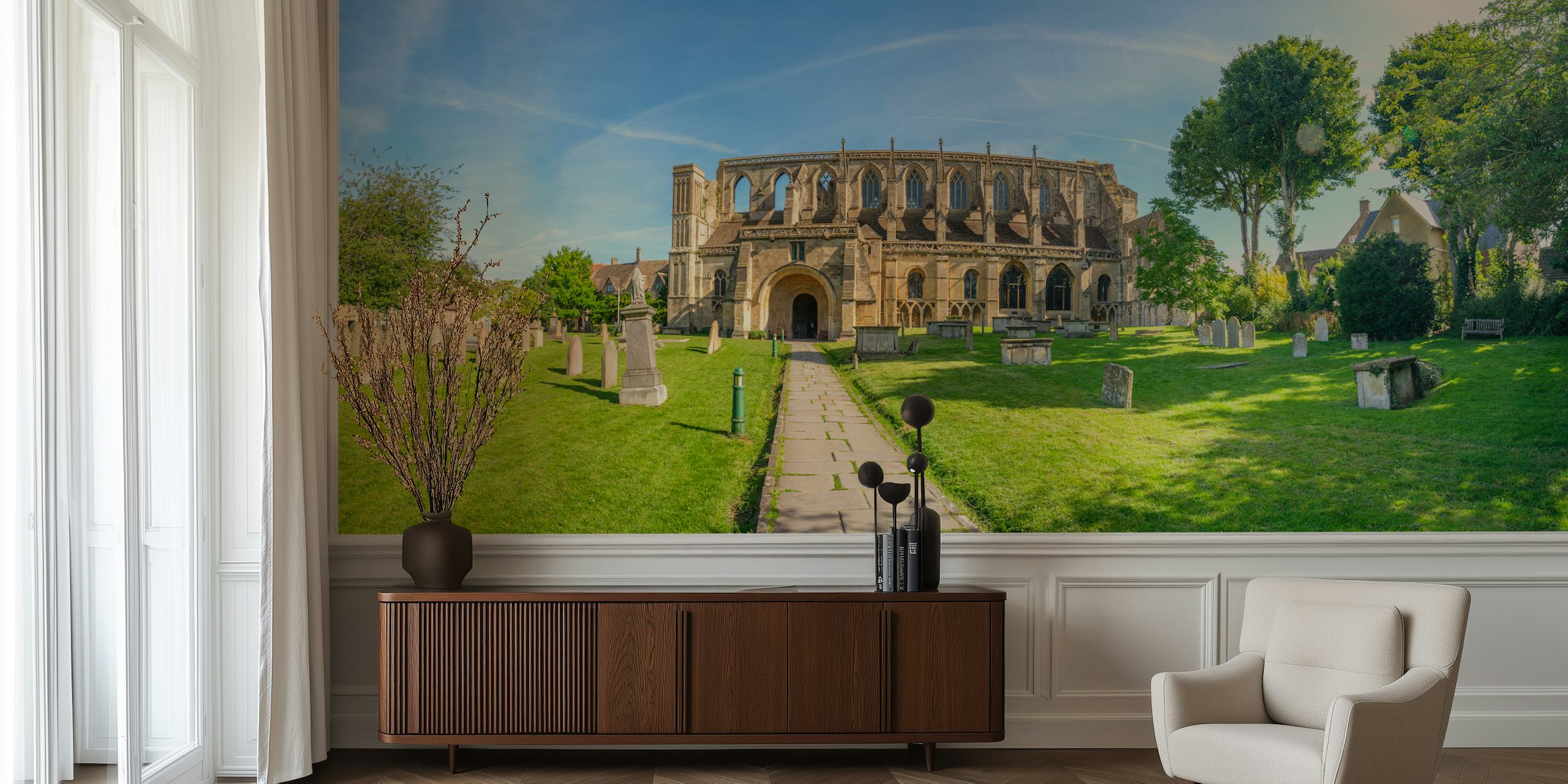 Medieval stone church with green grass and trees wallpaper
