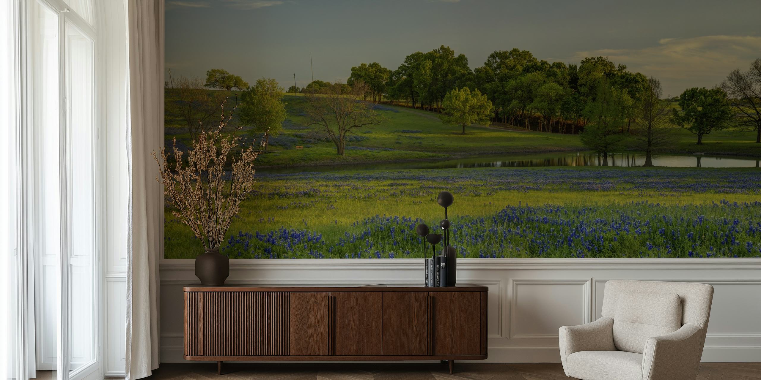 Blue floral patterns over green grass wallpaper