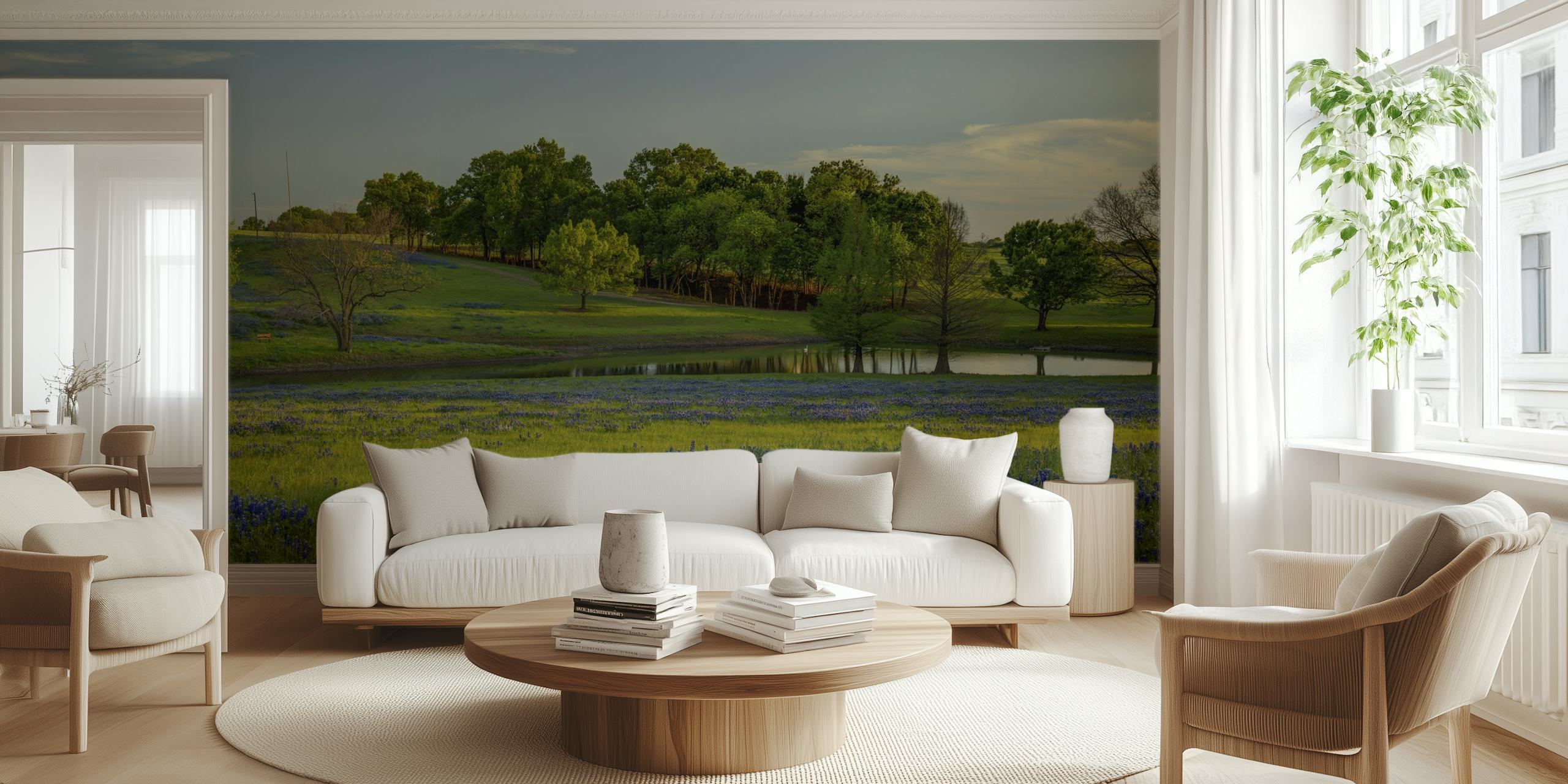 Blue floral patterns over green grass wallpaper