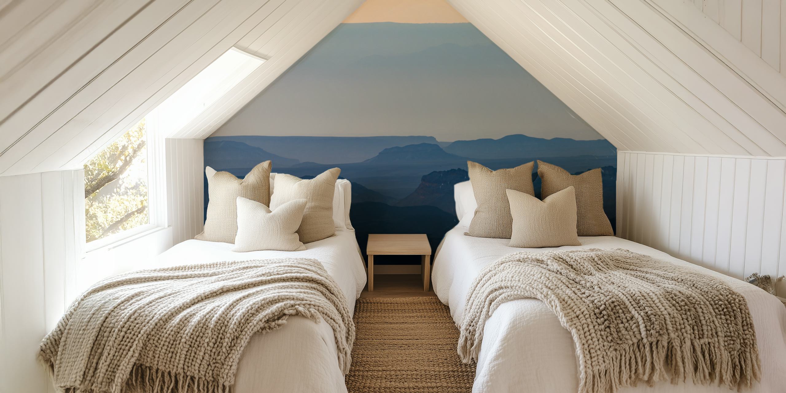 Landscape wallpaper featuring sunrise over mountains in soft blue hues