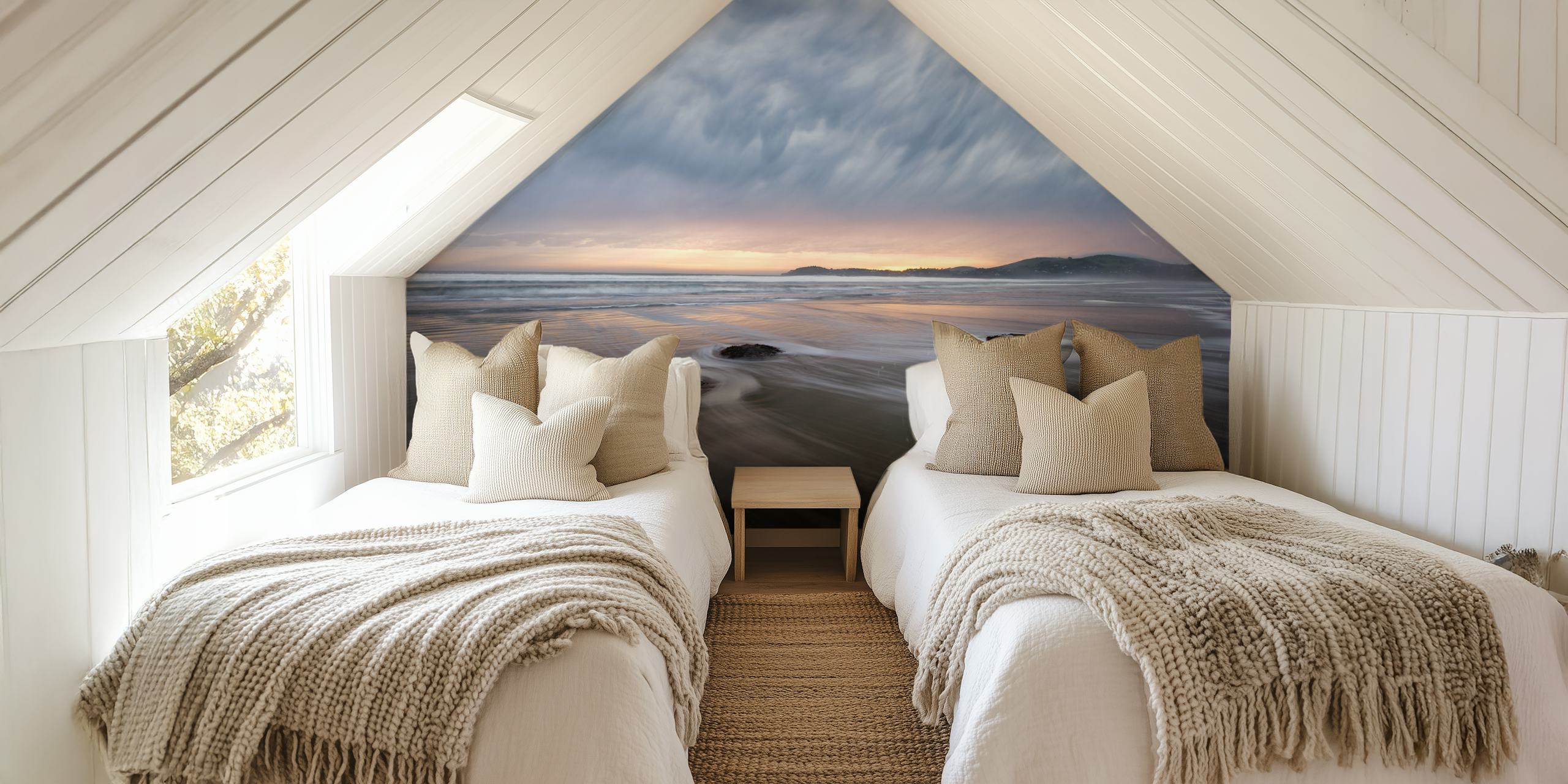 Beach landscape with flowing waves, gray clouds and soft sunset hues wallpaper