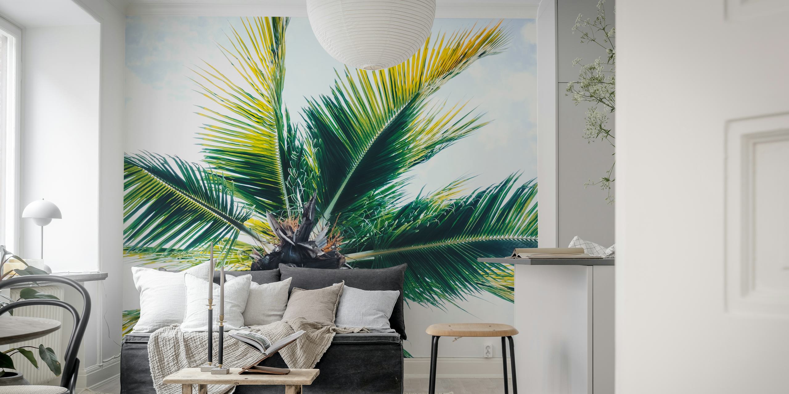 Palm tree leaves against a cloudy sky wallpaper