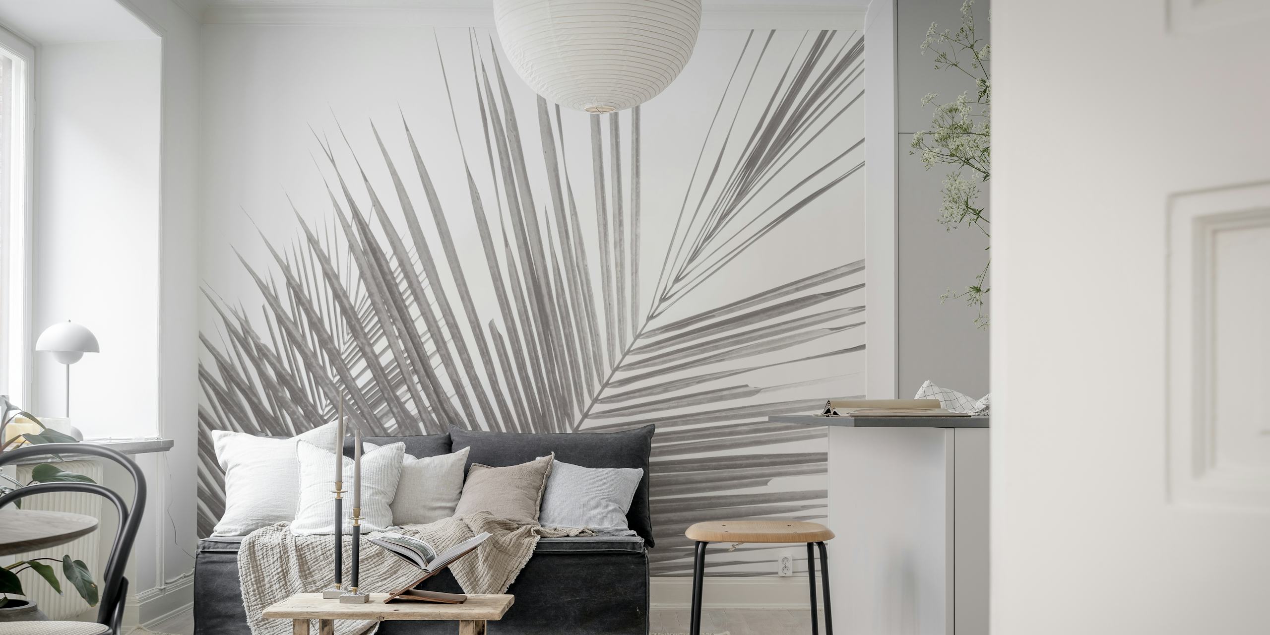 Monochrome tropical palm leaves wallpaper in a room