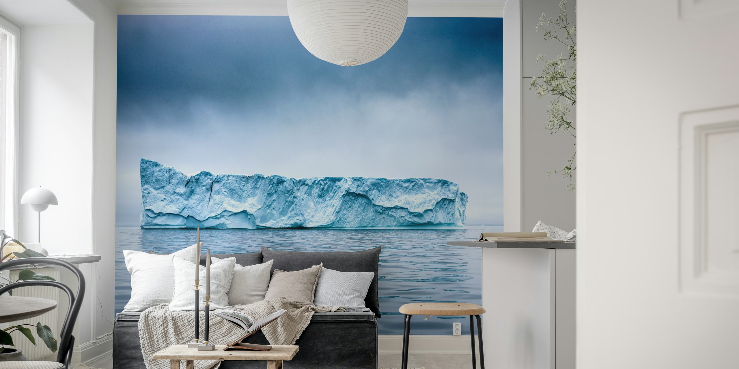 Iceberg floating in calm waters under a cloudy sky wallpaper