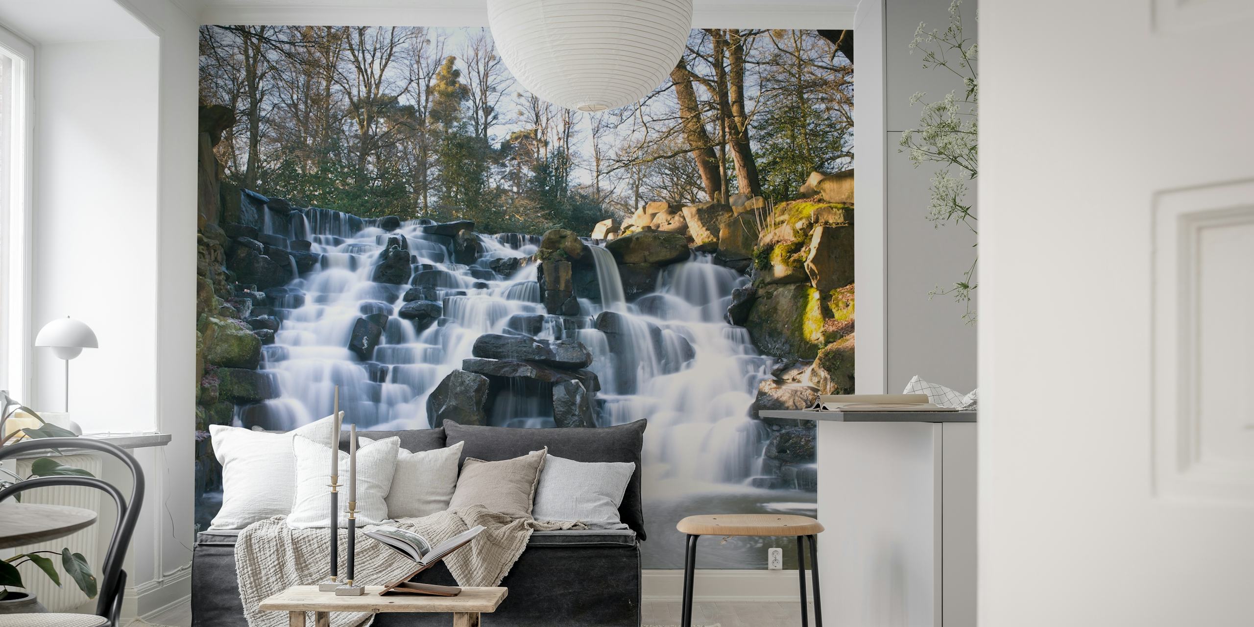 Waterfall cascading over rocks surrounded by trees wallpaper