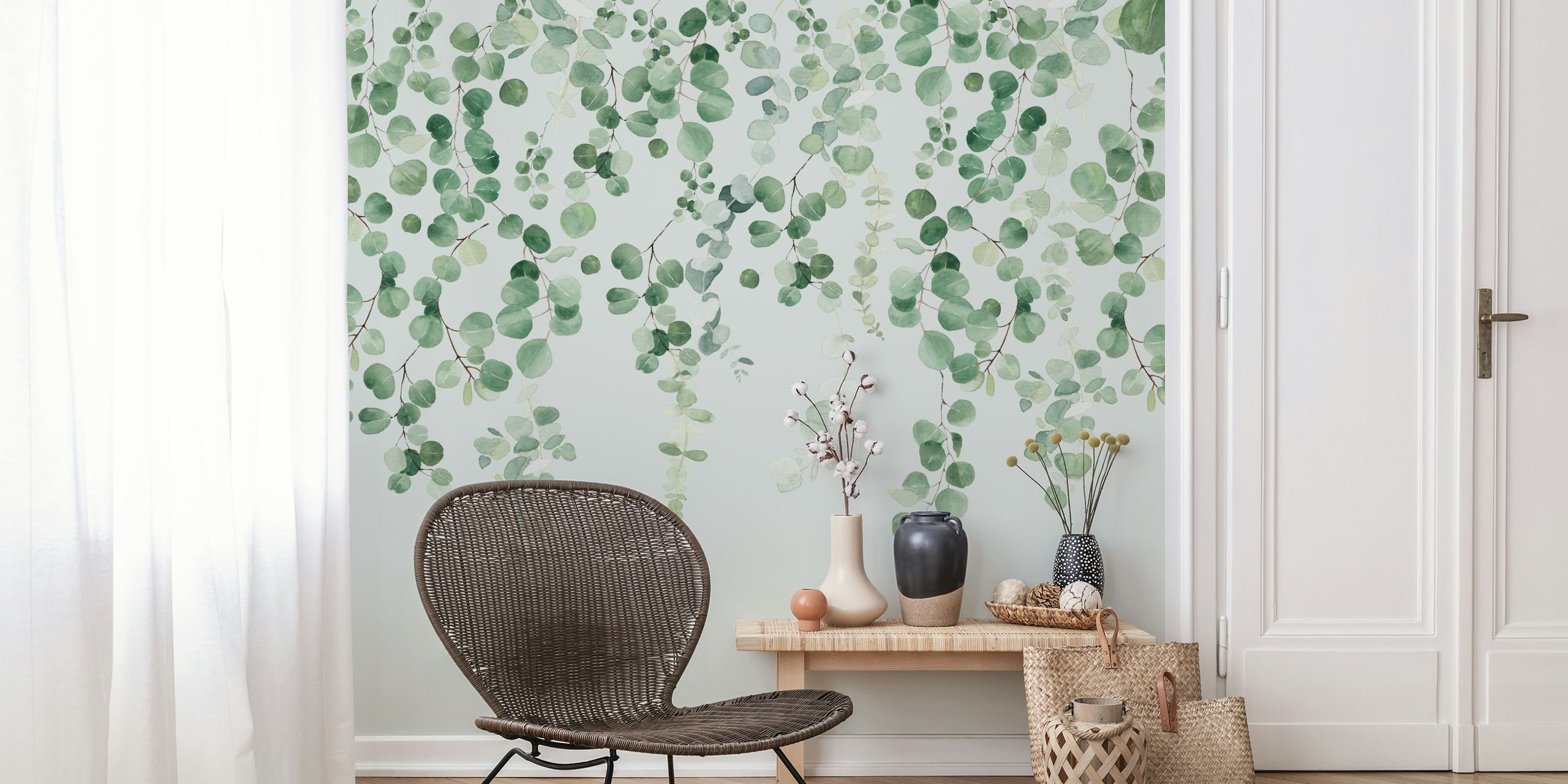 Hanging green eucalyptus leaves on a light background wallpaper