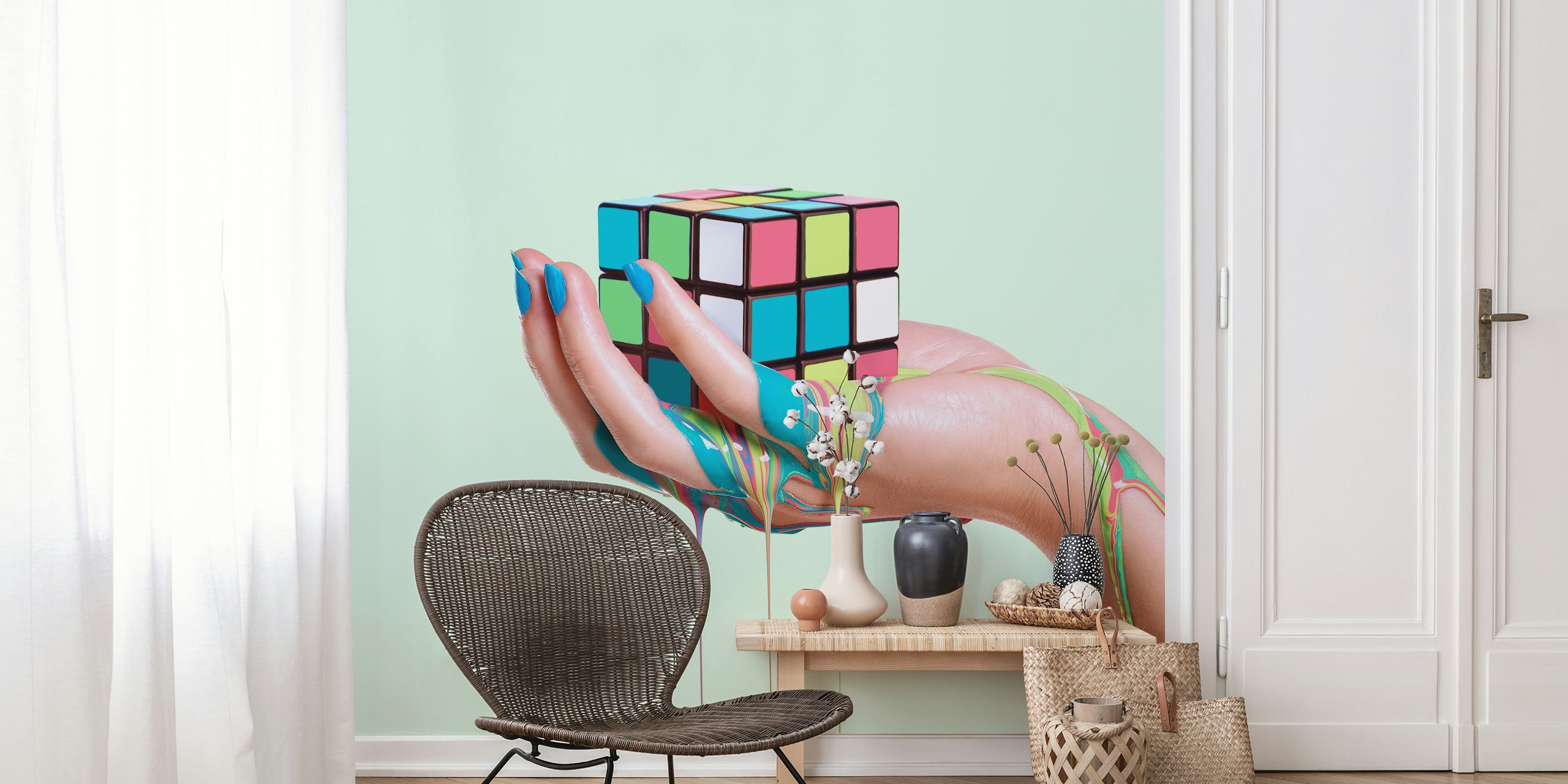 Colorful abstract Rubik's Cube held in a hand with dripping paint wallpaper