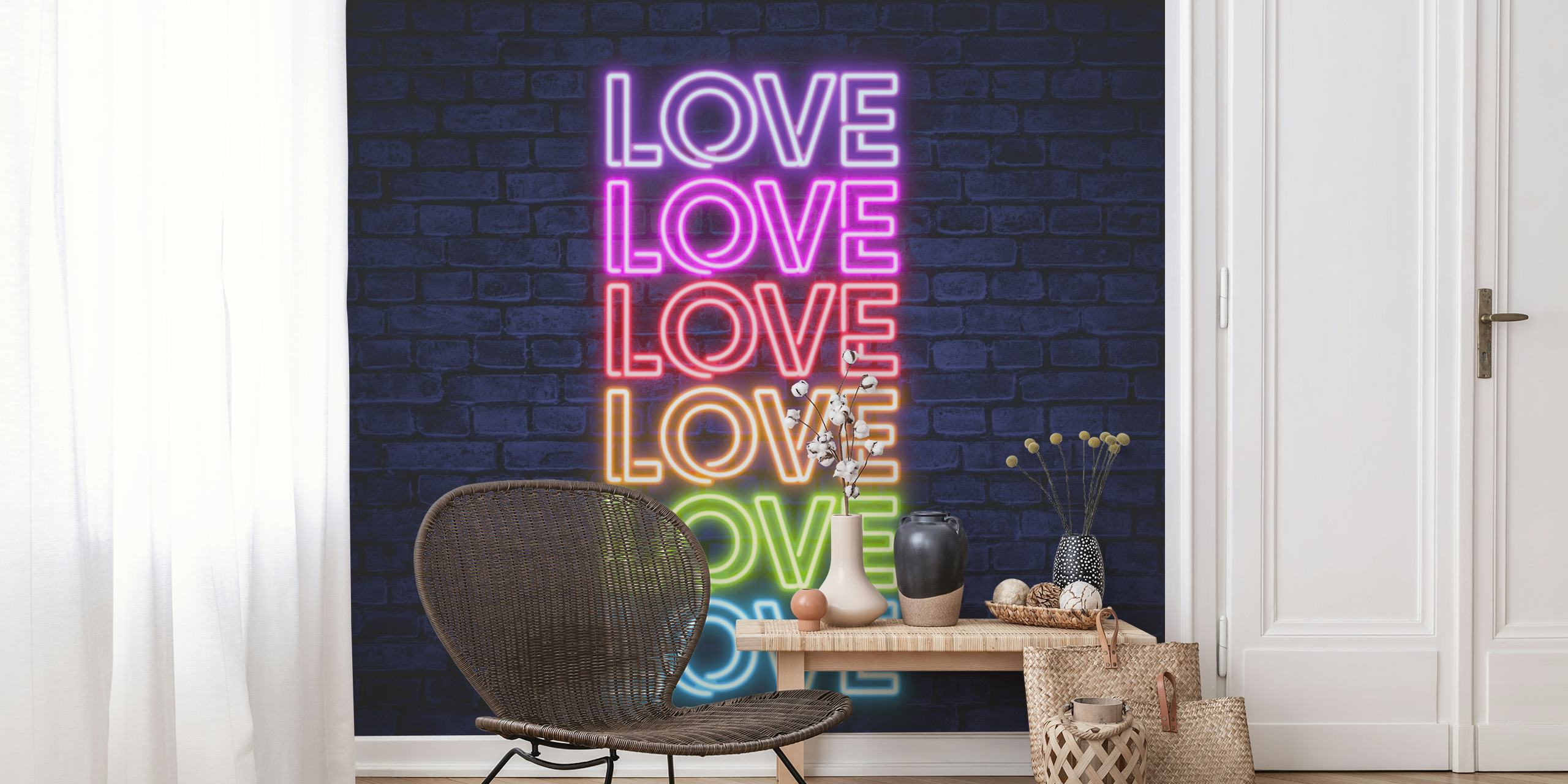 Neon love typography in pink, blue, and yellow on a brick wall background wall mural