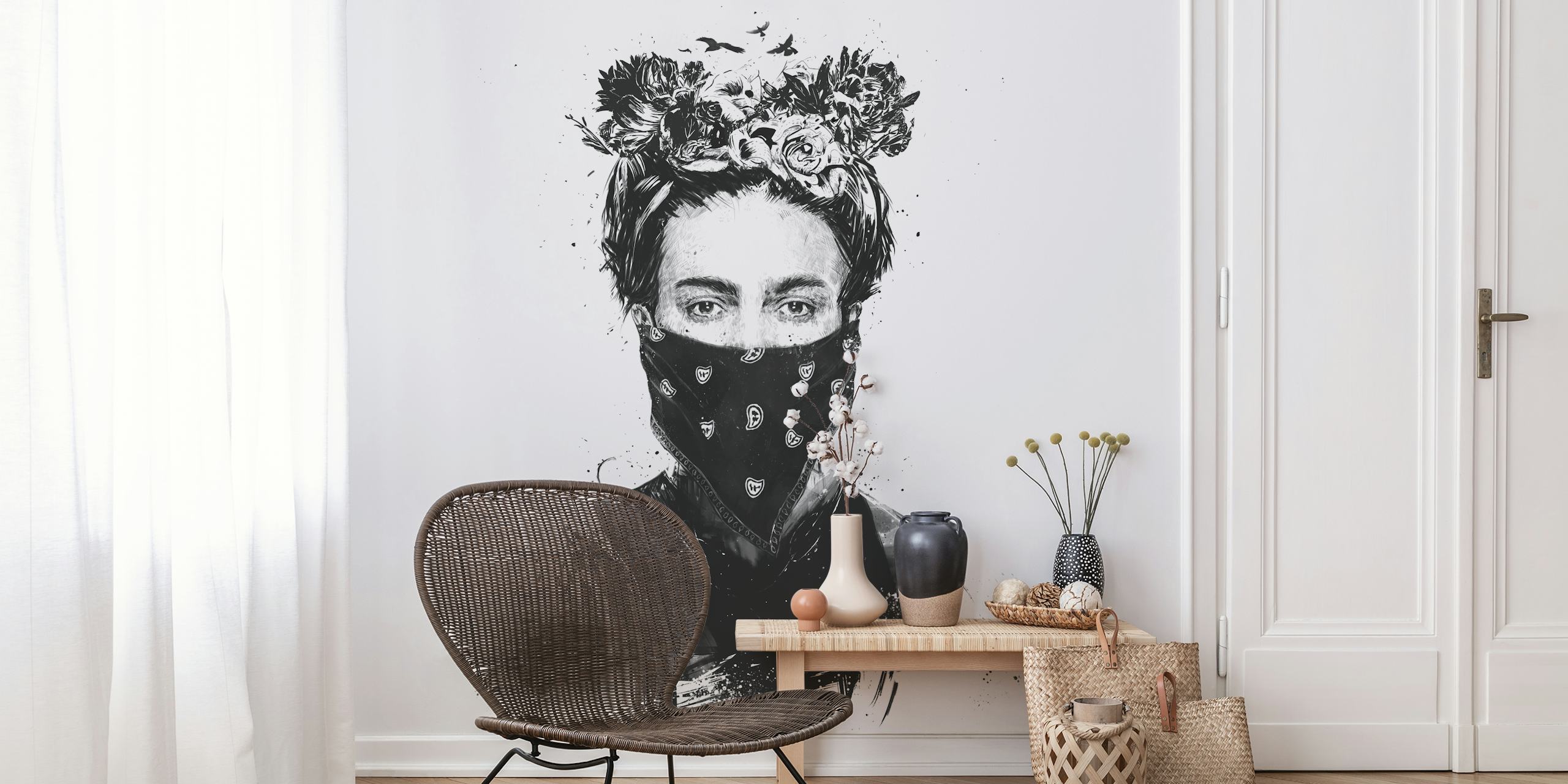 Black and white wall mural of a girl with a flower crown and a patterned scarf over her face