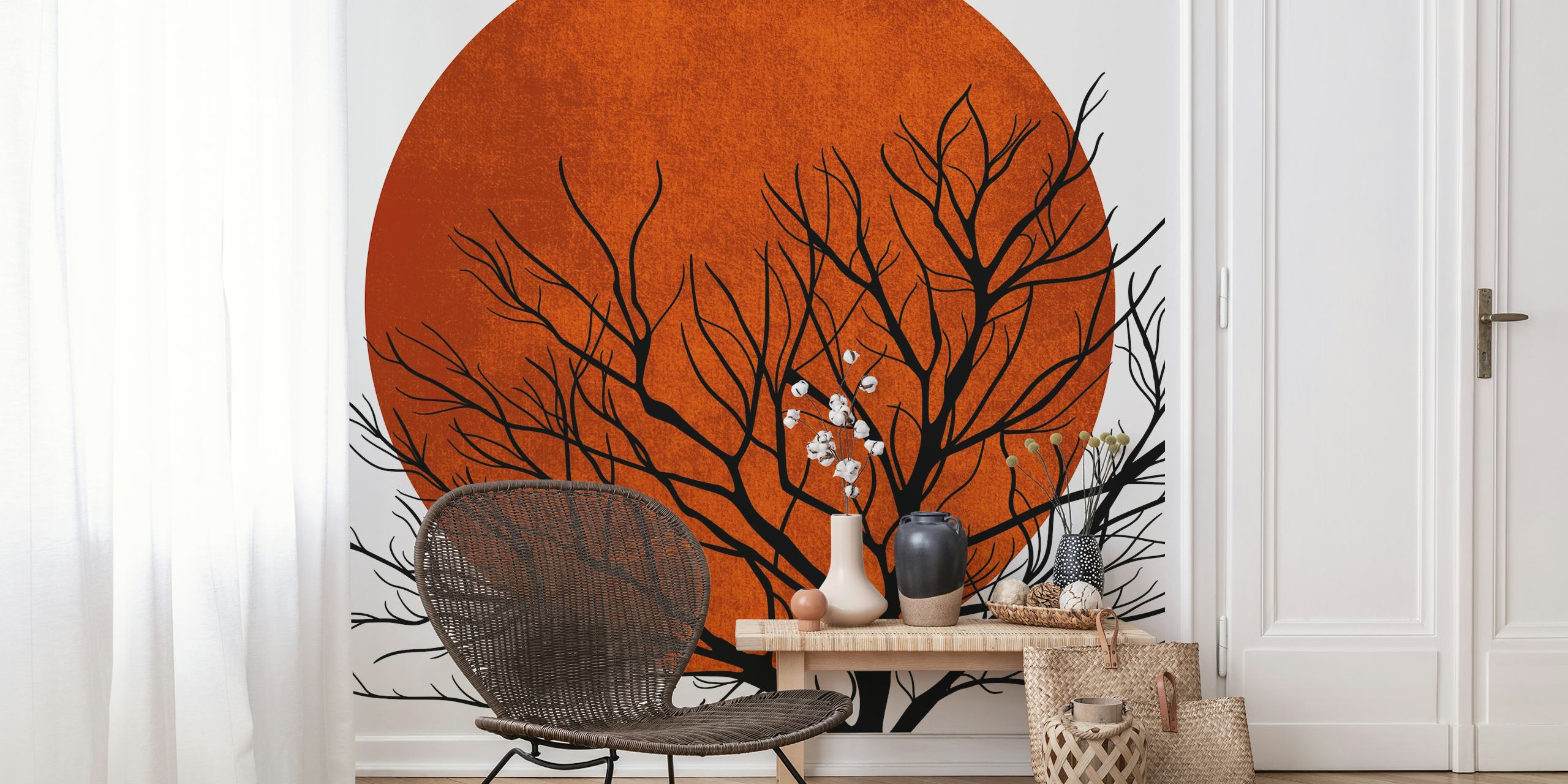 Carta da parati raffigurante la silhouette di un albero spoglio sullo sfondo di un tramonto invernale arancione